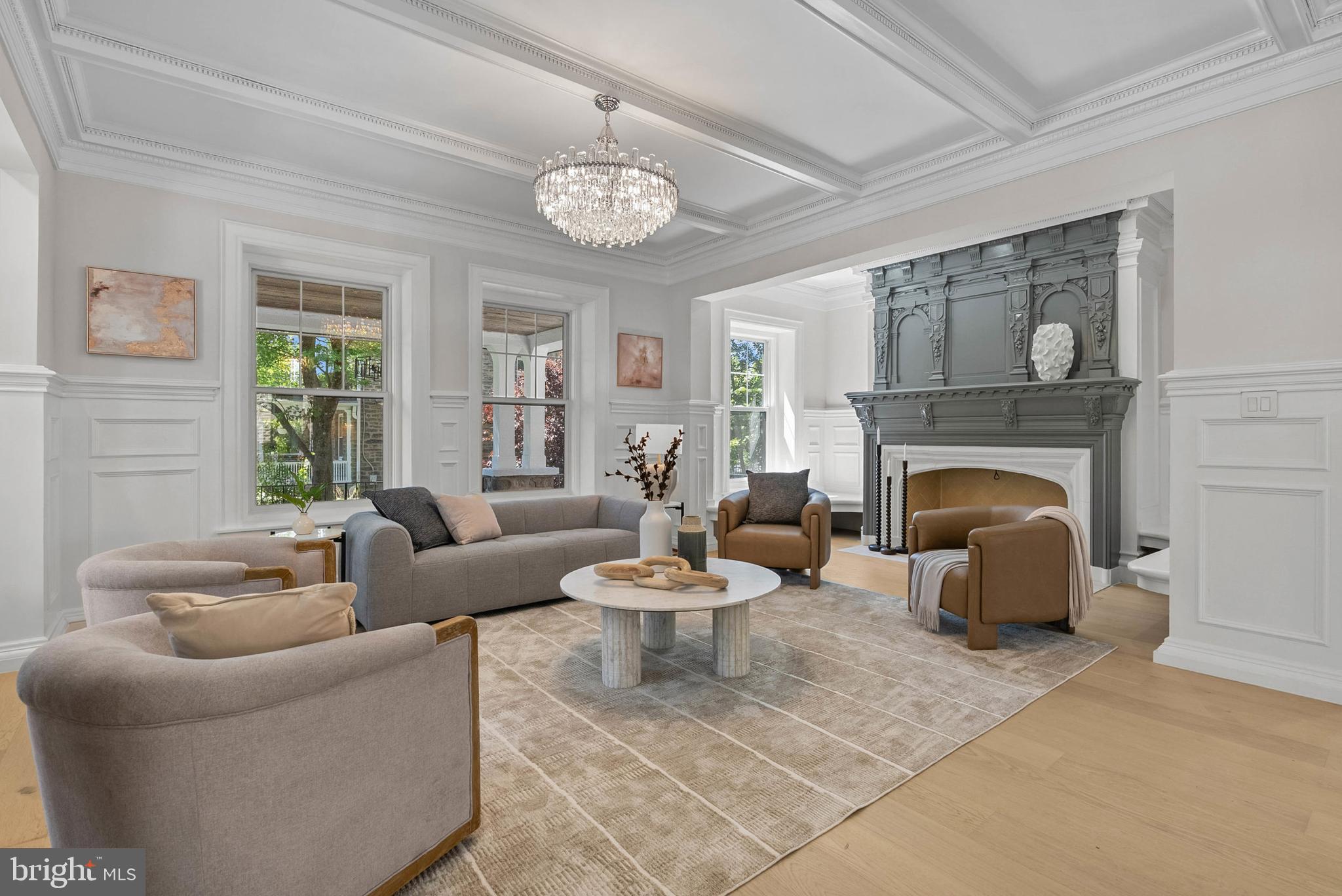 319 Pelham Road Philadelphia, PA 19119 - Photo 11 of 40 a living room with furniture a fireplace and a large window
