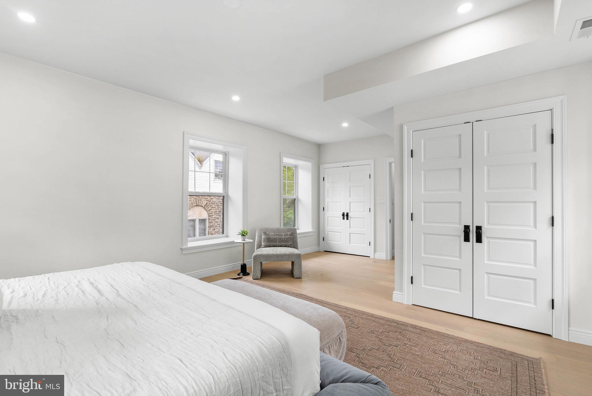 319 Pelham Road Philadelphia, PA 19119 - Photo 17 of 40 a spacious bedroom with a bed and a window