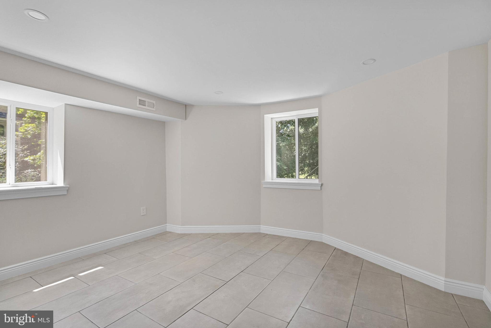 319 Pelham Road Philadelphia, PA 19119 - Photo 27 of 40 an empty room with windows