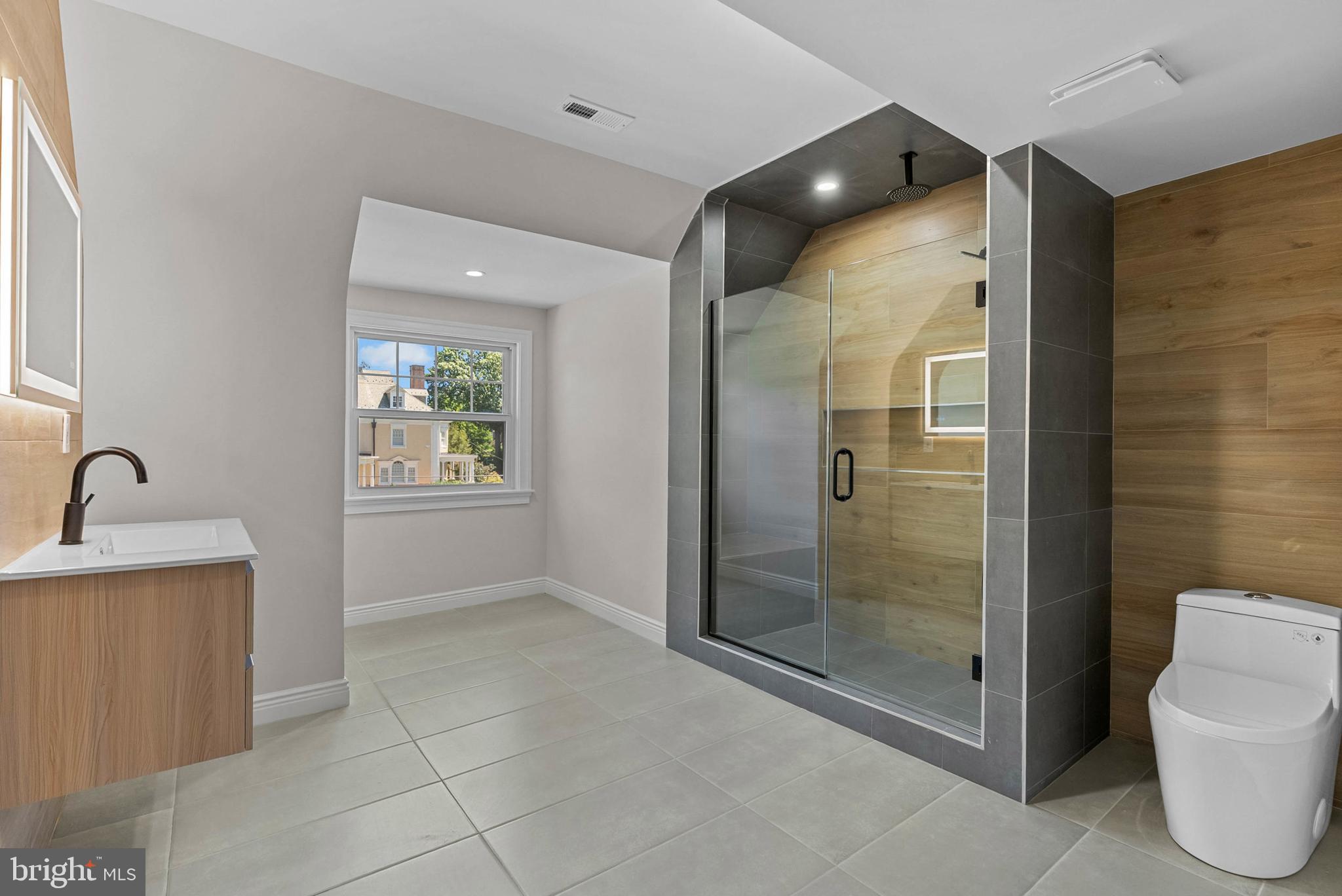 319 Pelham Road Philadelphia, PA 19119 - Photo 29 of 40 a bathroom with a shower and toilet