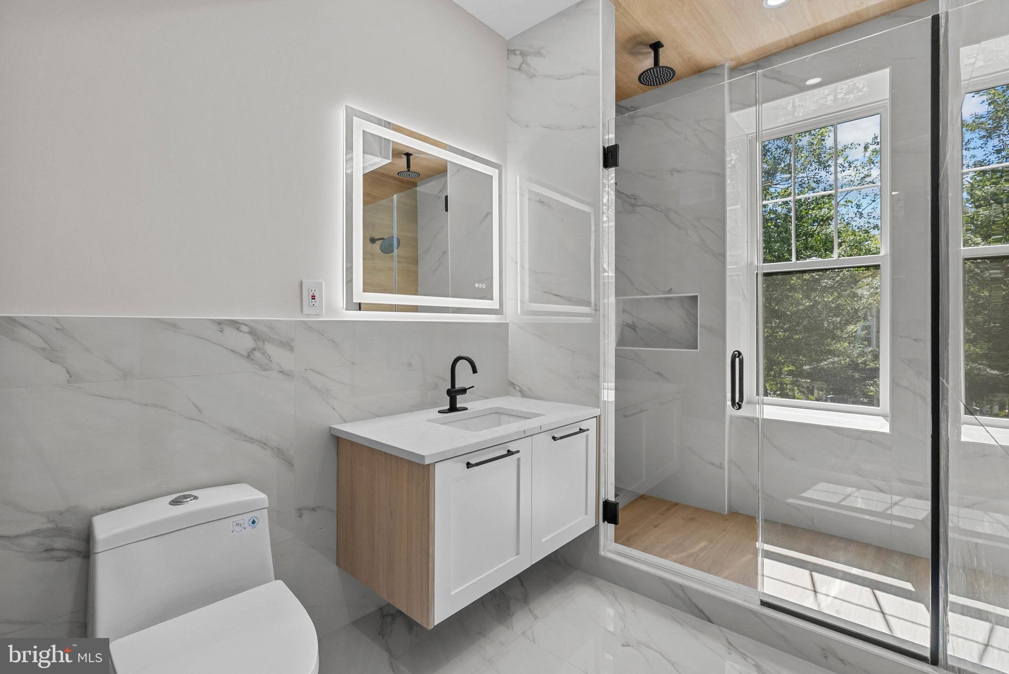 319 Pelham Road Philadelphia, PA 19119 - Photo 32 of 40 a bathroom with a toilet sink and mirror