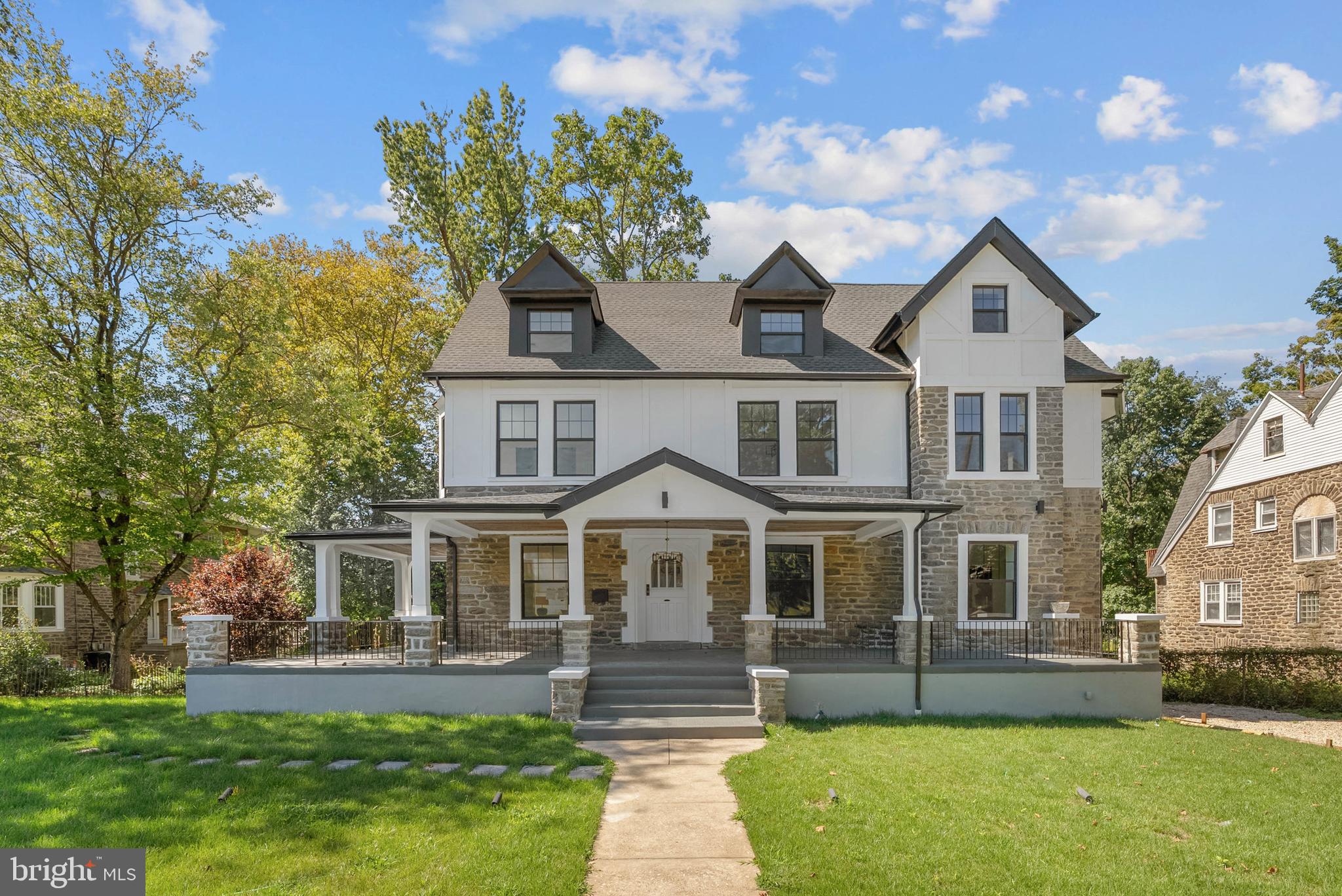 319 Pelham Road Philadelphia, PA 19119 - Photo 38 of 40 a front view of a house with a yard