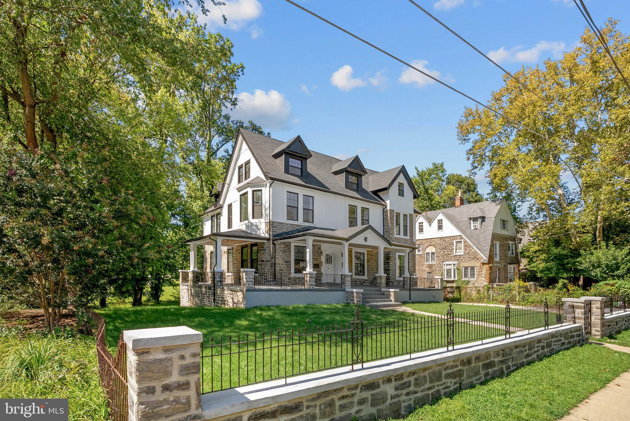 319 Pelham Road Philadelphia, PA 19119 - Photo 39 of 40 a front view of a house with a yard table and chairs