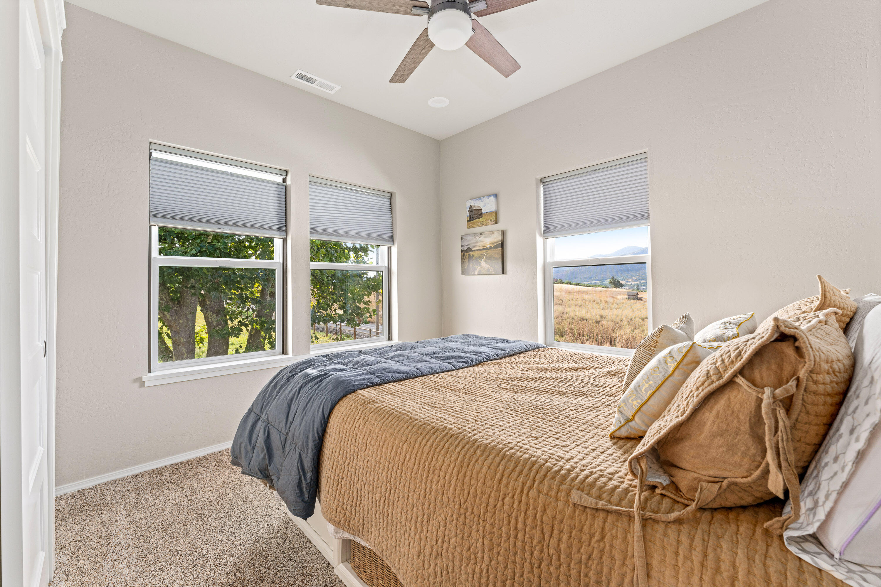 995 Suncrest Road Talent, OR 97540 - Photo 24 of 96 a bedroom with a bed and a window