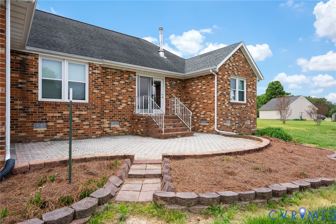 16379 Arch Hill Road Hanover, VA 23069 - Photo 24 of 26 a front view of a house with a yard