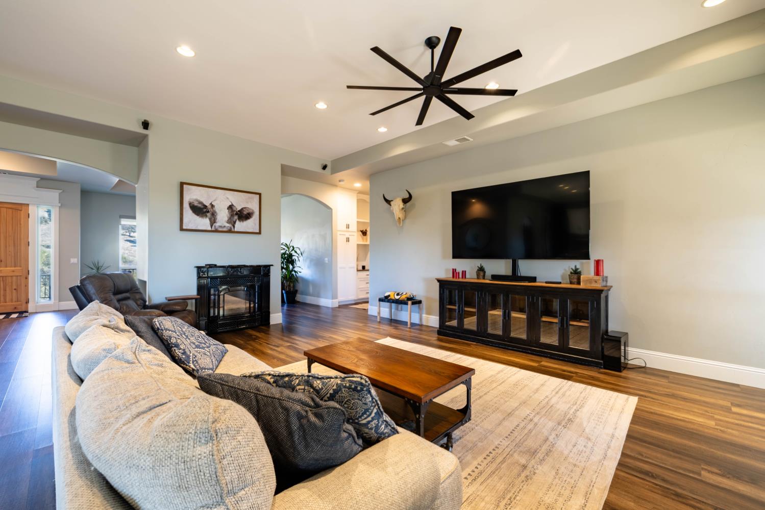 5840 China Hill Road El Dorado, CA 95623 - Photo 11 of 84 a living room with furniture and a flat screen tv
