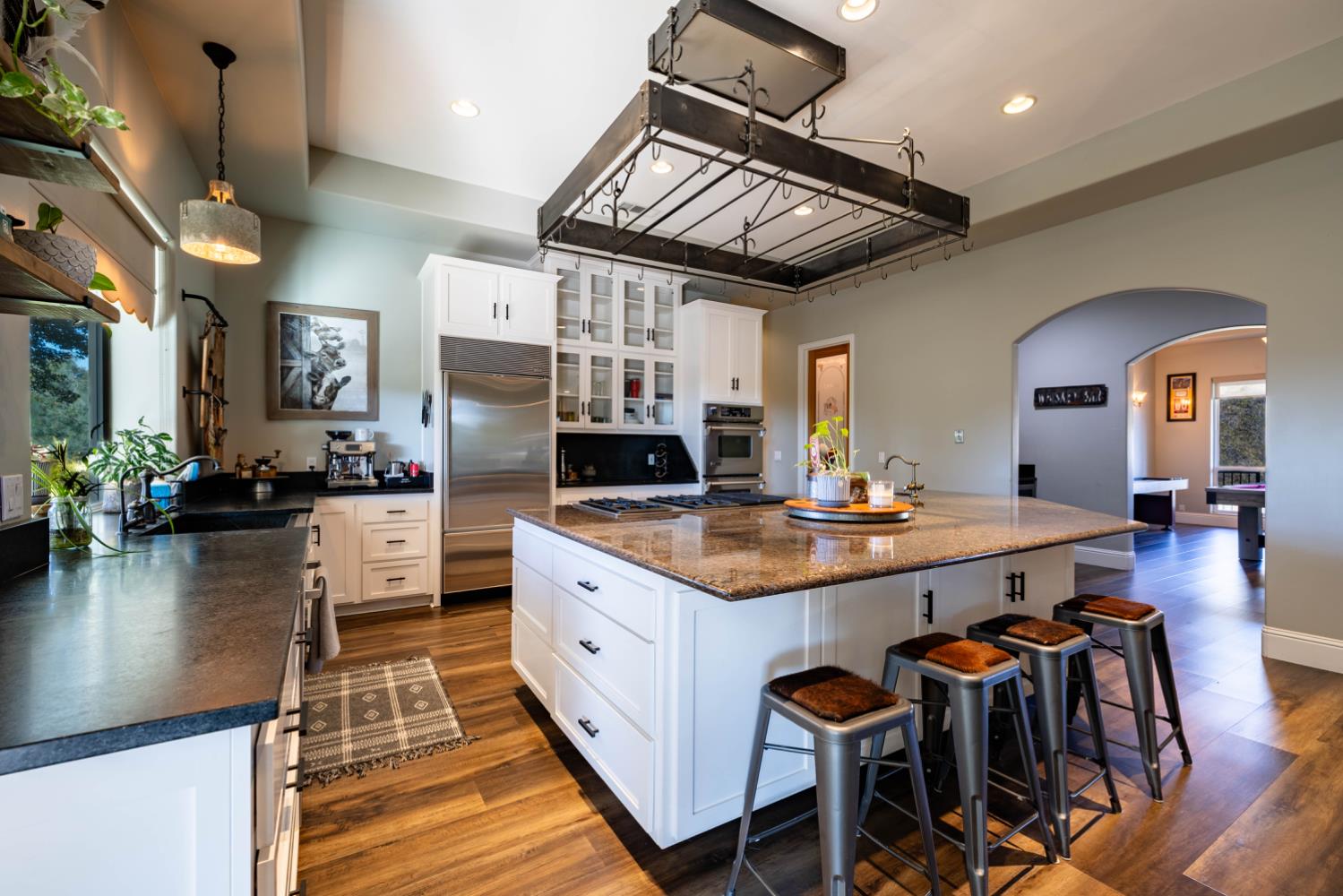 5840 China Hill Road El Dorado, CA 95623 - Photo 14 of 84 a kitchen with stainless steel appliances granite countertop a stove a sink dishwasher and a refrigerator with wooden floor