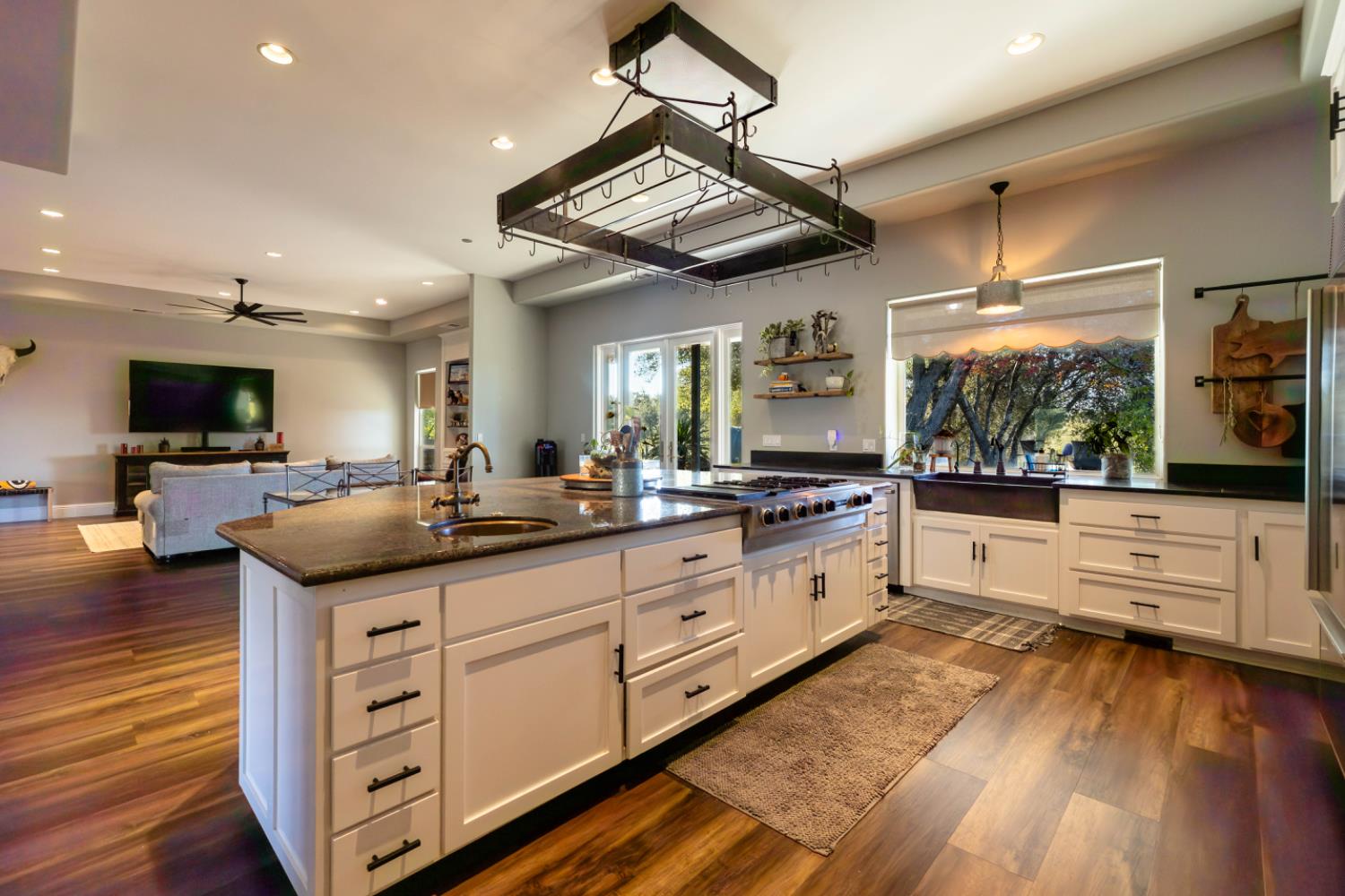 5840 China Hill Road El Dorado, CA 95623 - Photo 17 of 84 a large kitchen with stainless steel appliances kitchen island granite countertop a stove and a view of living room