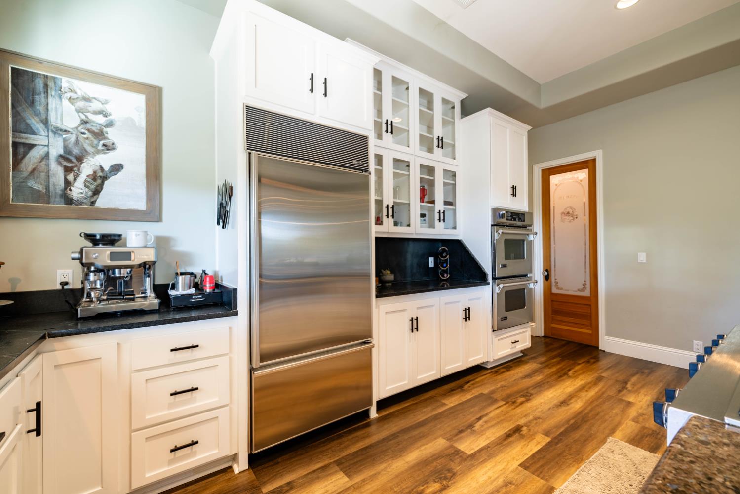 5840 China Hill Road El Dorado, CA 95623 - Photo 19 of 84 a kitchen with cabinets and wooden floor
