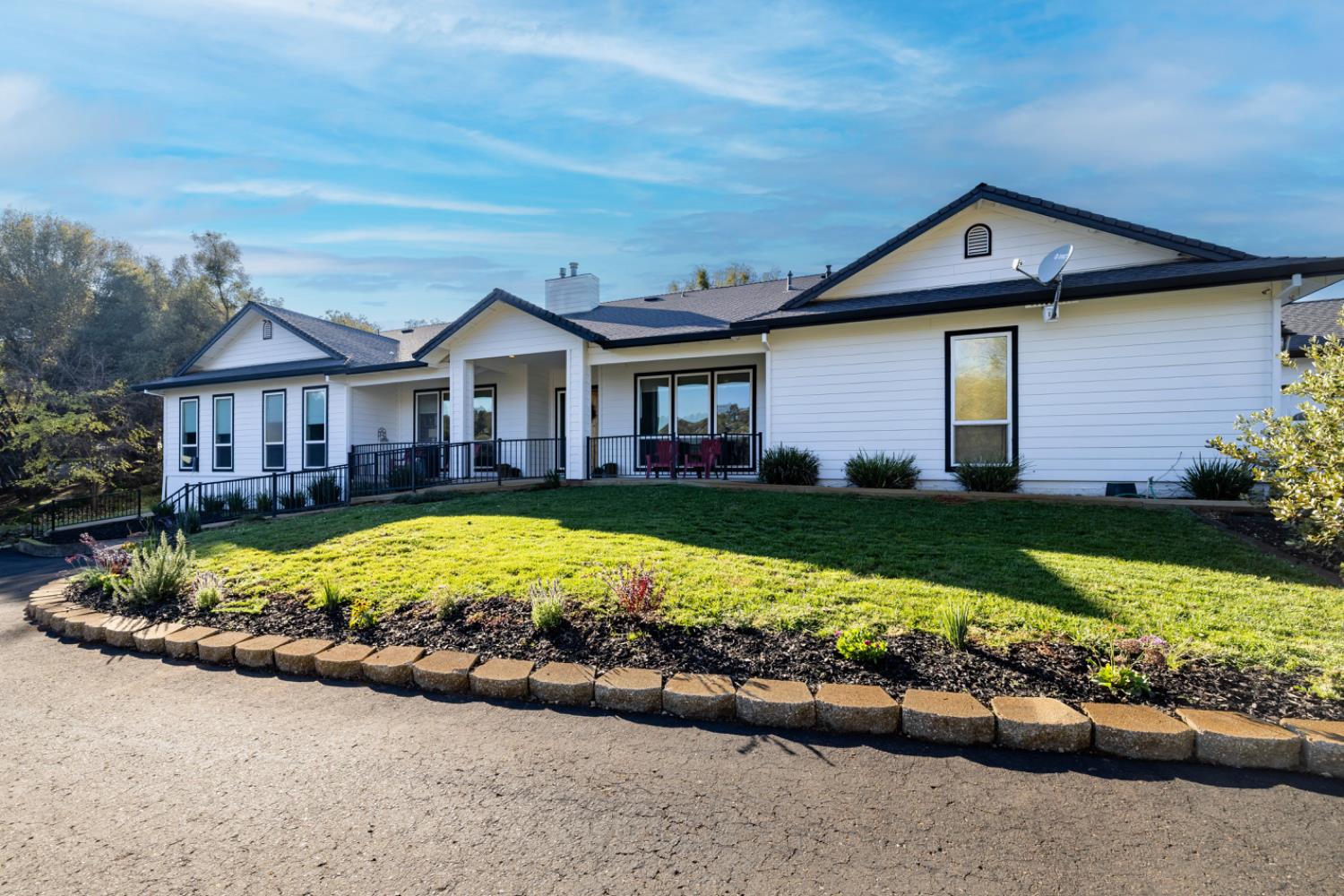 5840 China Hill Road El Dorado, CA 95623 - Photo 2 of 84 a front view of a house with a garden and plants