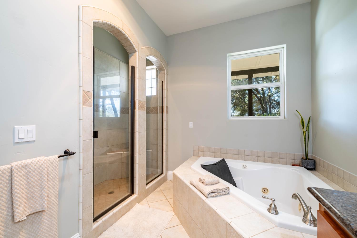 5840 China Hill Road El Dorado, CA 95623 - Photo 35 of 84 a bathroom with a tub and a shower