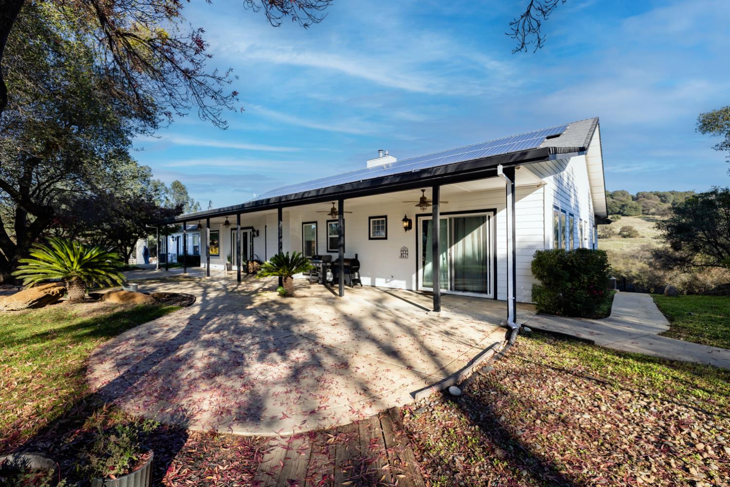 5840 China Hill Road El Dorado, CA 95623 - Photo 55 of 84 a view of a house with backyard porch and sitting area