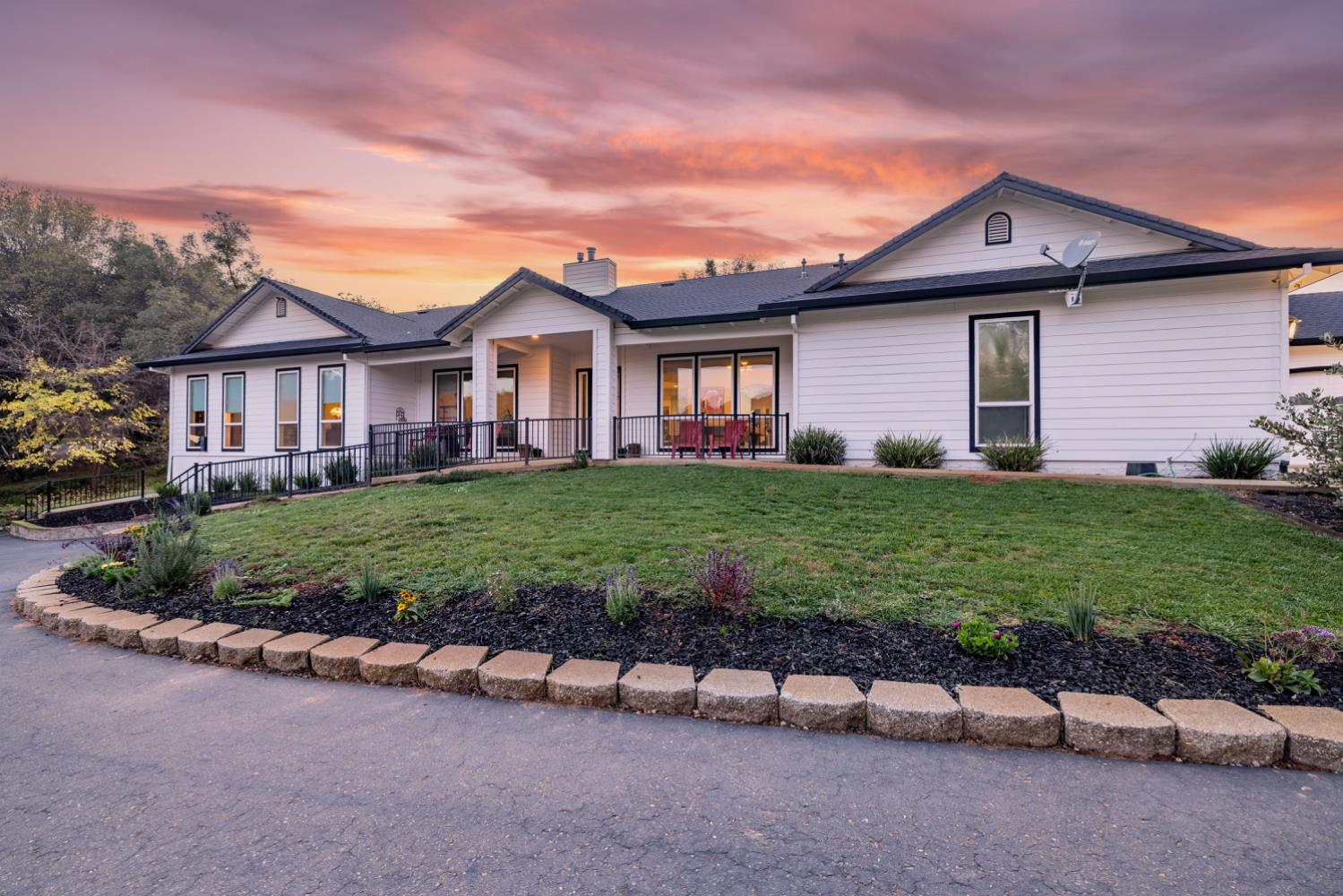 5840 China Hill Road El Dorado, CA 95623 - Photo 57 of 84 a front view of a house with a yard and garage