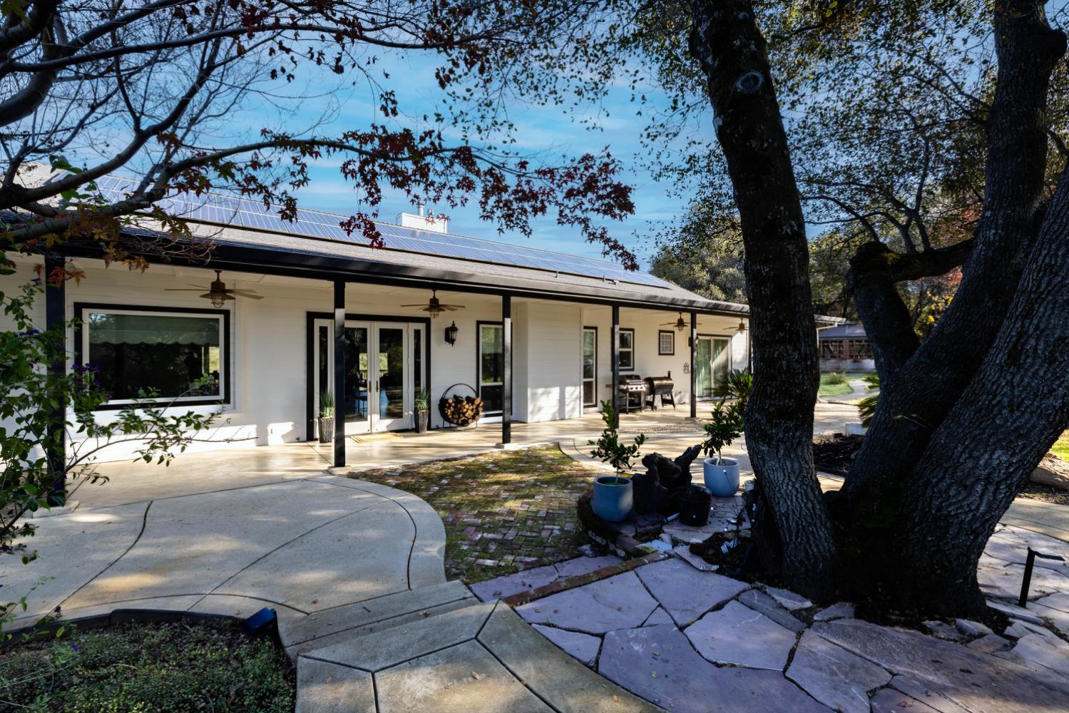 5840 China Hill Road El Dorado, CA 95623 - Photo 60 of 84 a view of a house with backyard sitting area and garden