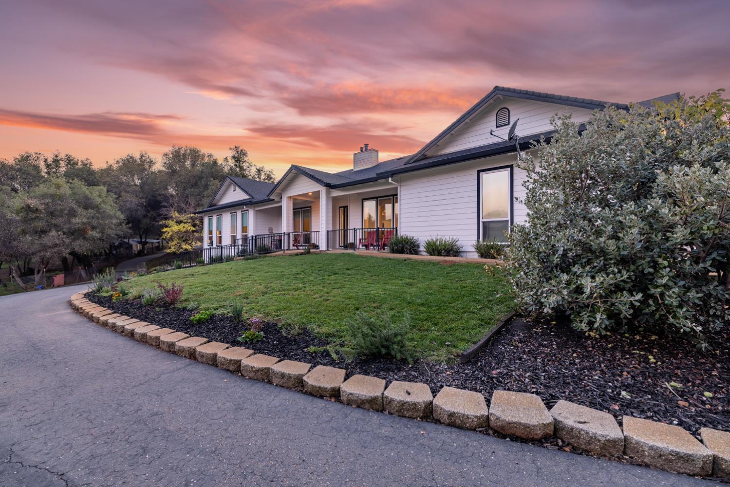 5840 China Hill Road El Dorado, CA 95623 - Photo 69 of 84 a front view of a house with a yard and garage