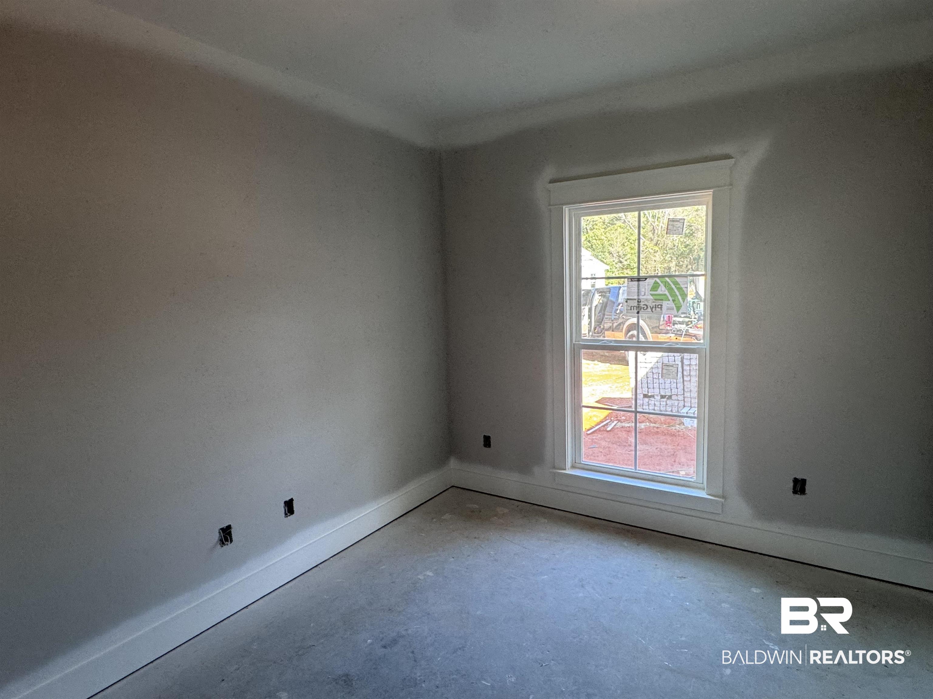 27371 Patch Pl Loop Daphne, AL 36526 - Photo 25 of 63 Unfurnished room featuring baseboards and concrete floors