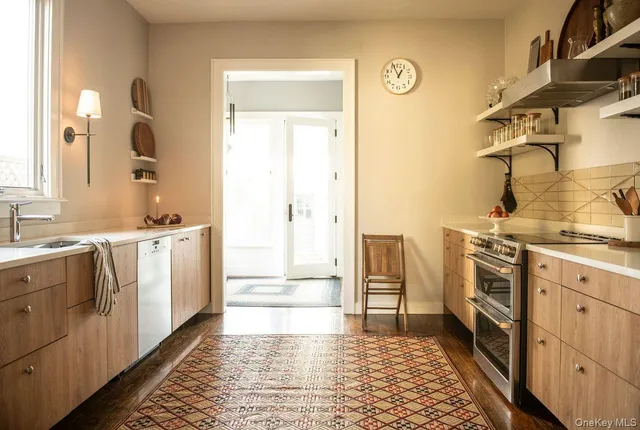 a bathroom with a sink a washer and dryer