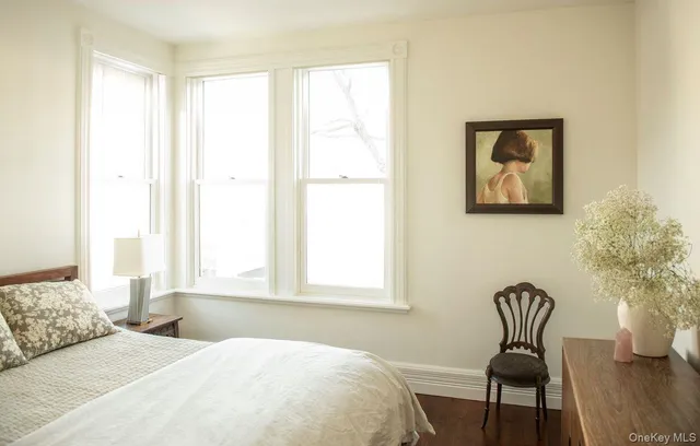 a bedroom with a bed and a chair