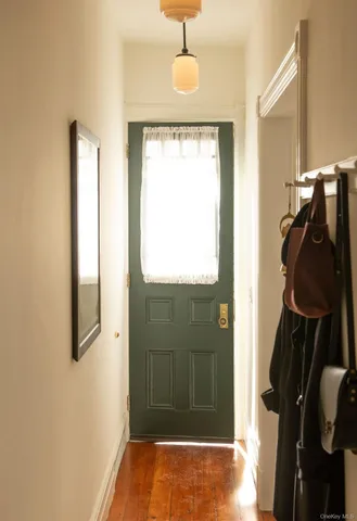 a bathroom with a window and a shower