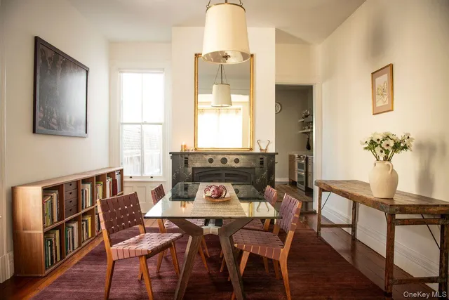 a view of a dining room with furniture window and wooden floor