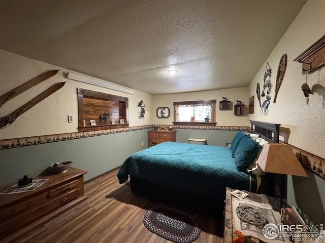 a bedroom with furniture and a window