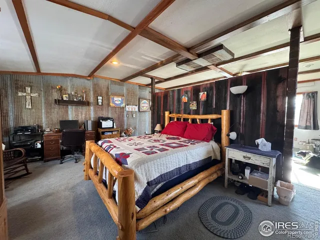 a bed sitting in a room next to a window