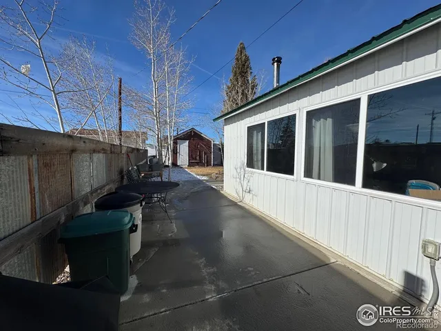a view of a balcony with chairs