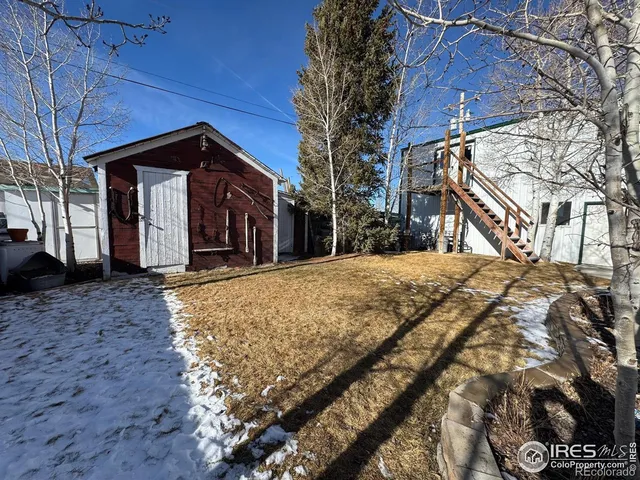 a view of a house with a snow in a yard