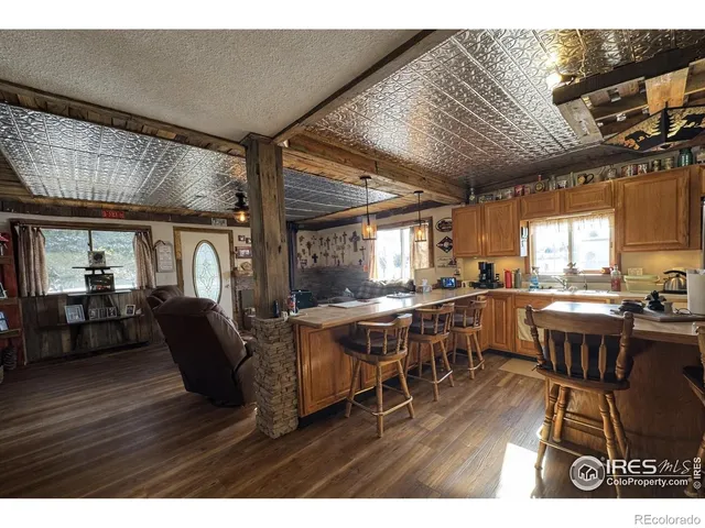 a dining hall with furniture window and wooden floor