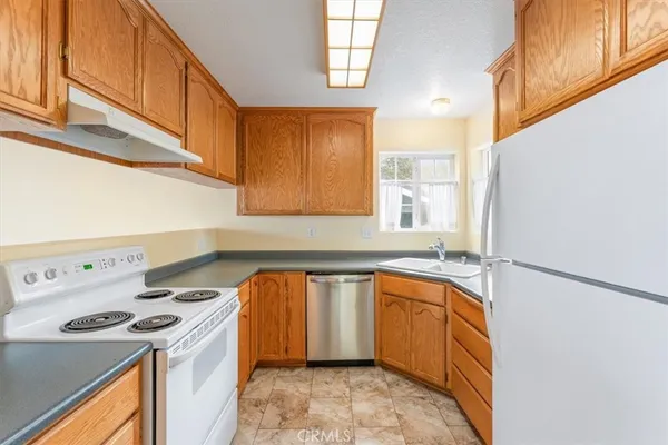 a utility room with sink dryer and washer
