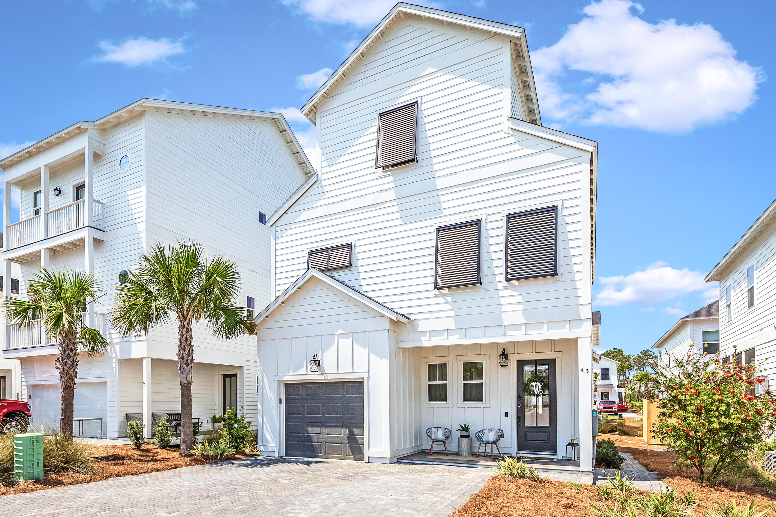 45 Valdare Ln Inlet Beach Inlet Beach, FL 32461 - Photo 1 of 37 a front view of a house with a yard