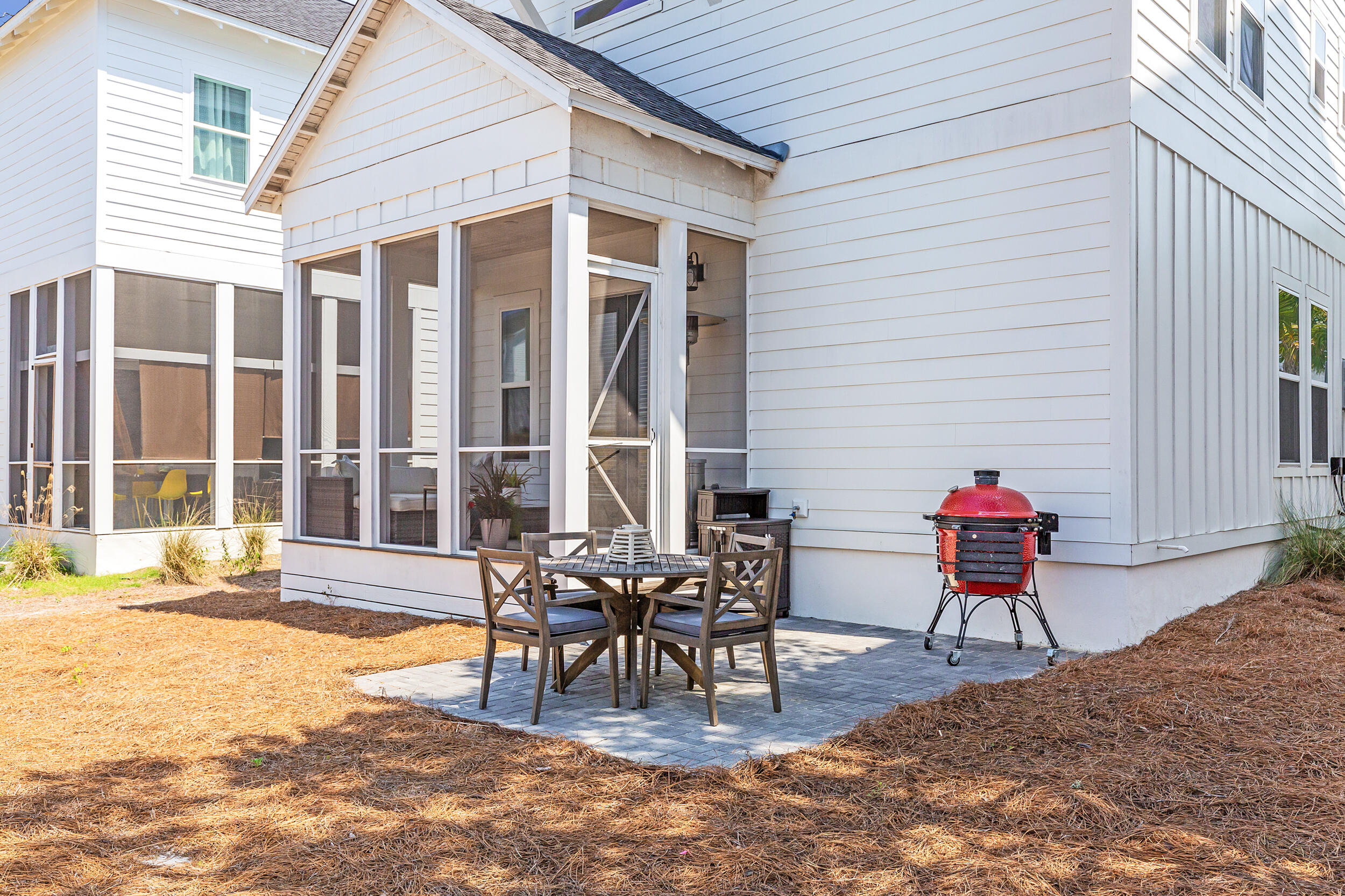 45 Valdare Ln Inlet Beach Inlet Beach, FL 32461 - Photo 19 of 37 a view of a patio with table and chairs and wooden floor
