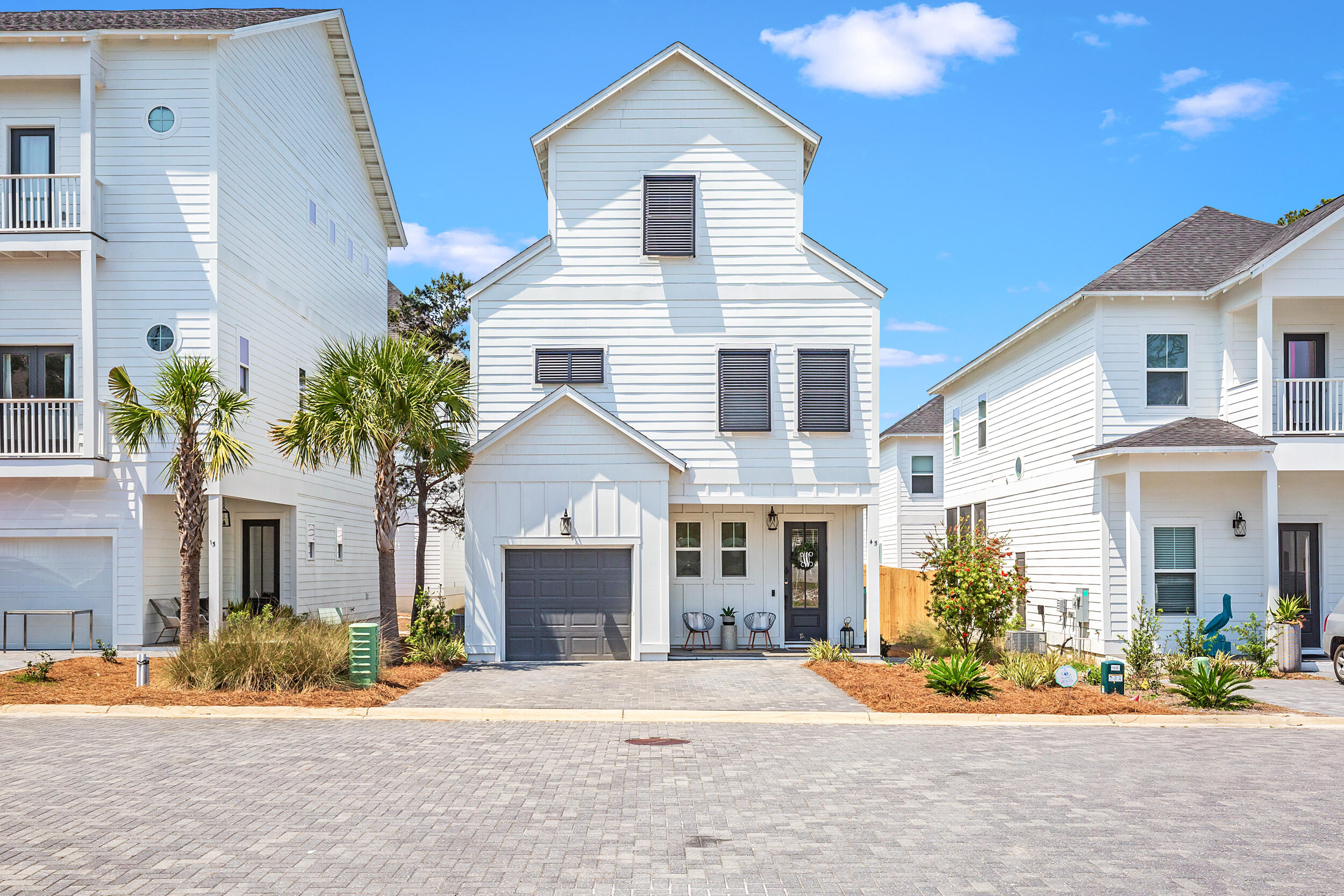 45 Valdare Ln Inlet Beach Inlet Beach, FL 32461 - Photo 2 of 37 a front view of a house with a yard and potted plants
