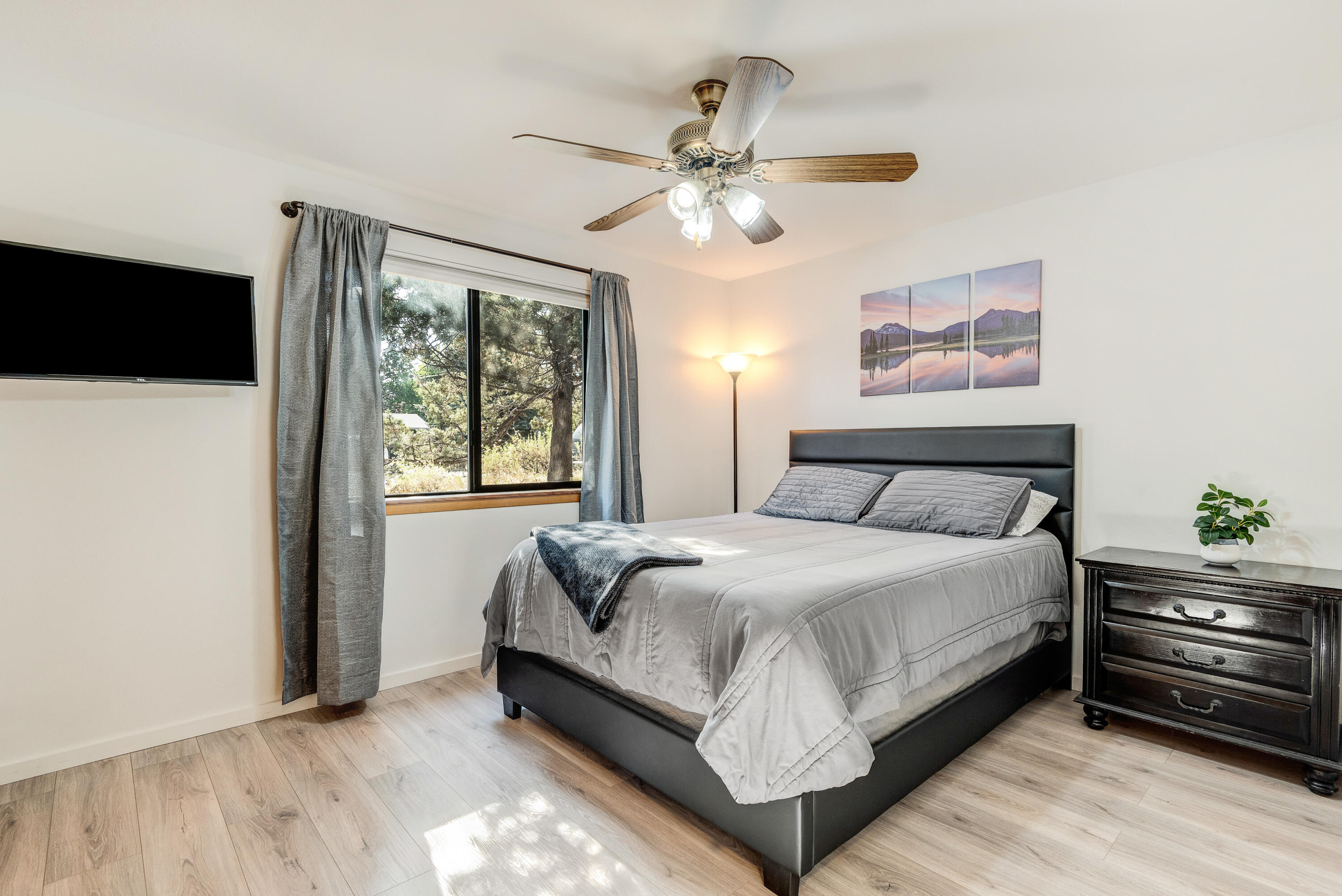 1916 Northeast Wichita Way Bend, OR 97701 - Photo 29 of 38 a bedroom with a bed and a chandelier