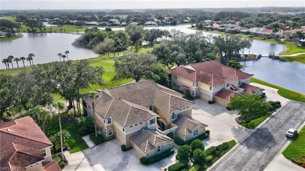 an aerial view of a house with outdoor space and lake view