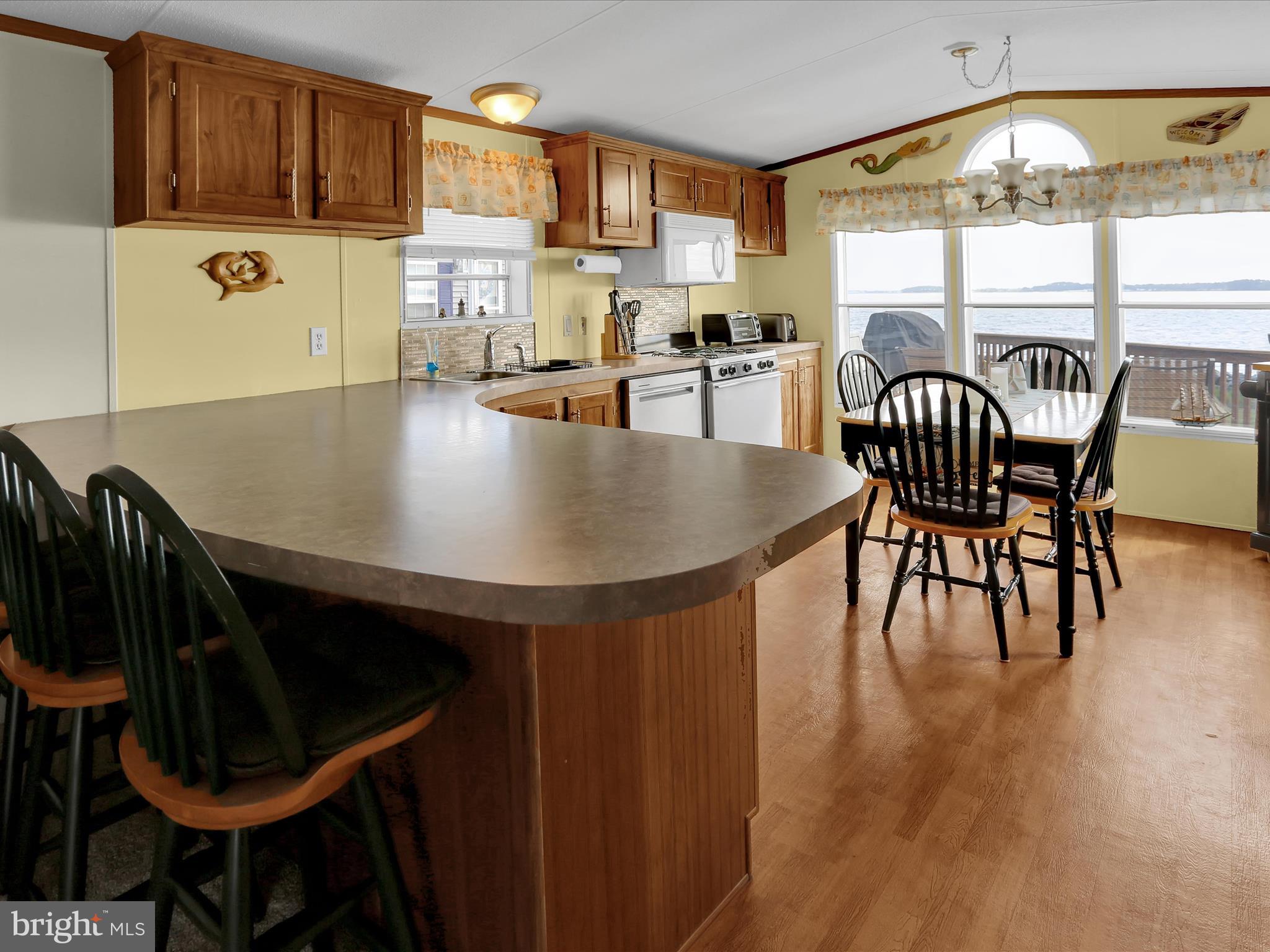 27412 Grove Circle Road Millsboro, DE 19966 - Photo 17 of 43 a dining room with furniture and window