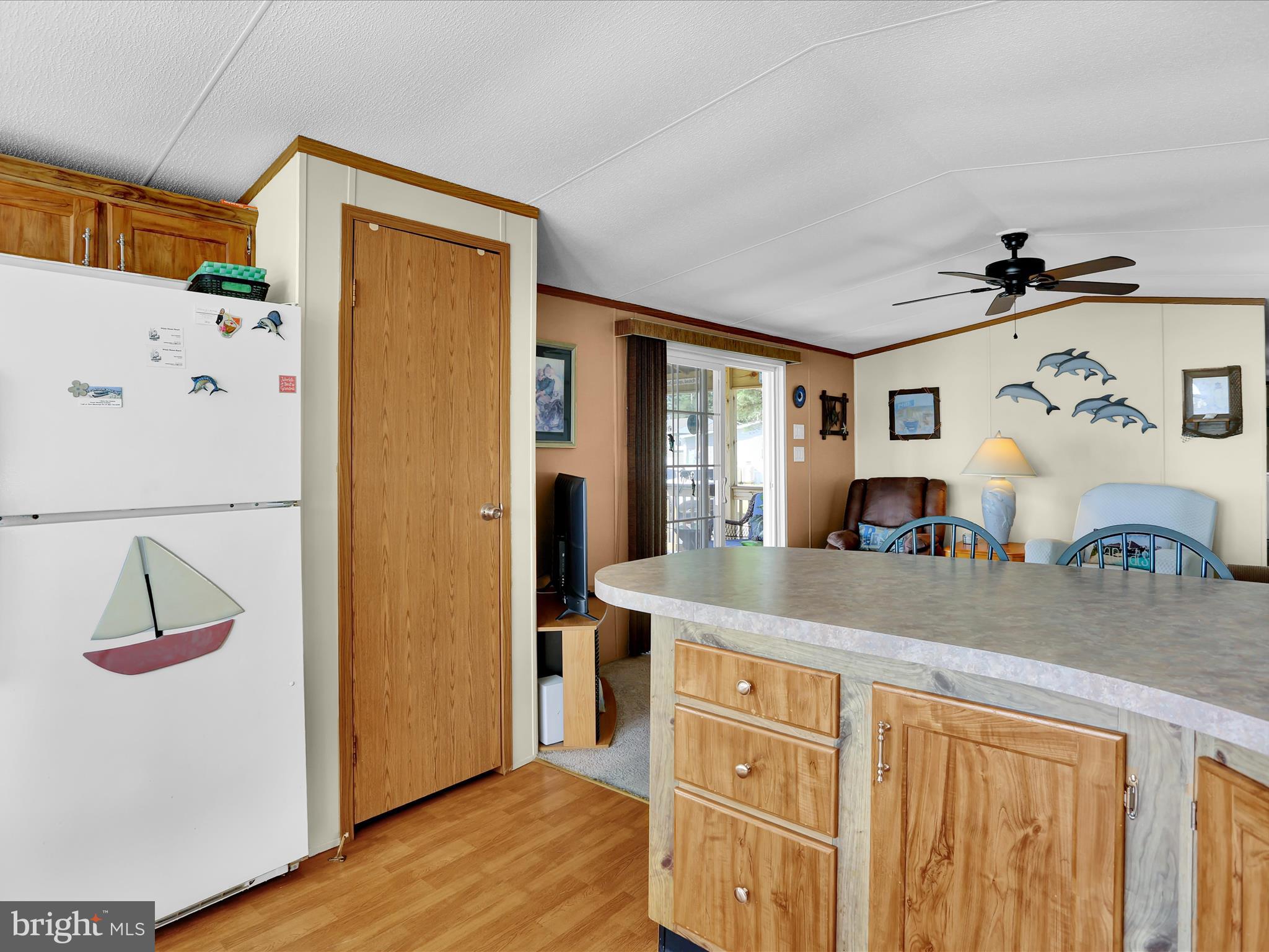 27412 Grove Circle Road Millsboro, DE 19966 - Photo 20 of 43 a kitchen with stainless steel appliances granite countertop a refrigerator and a sink