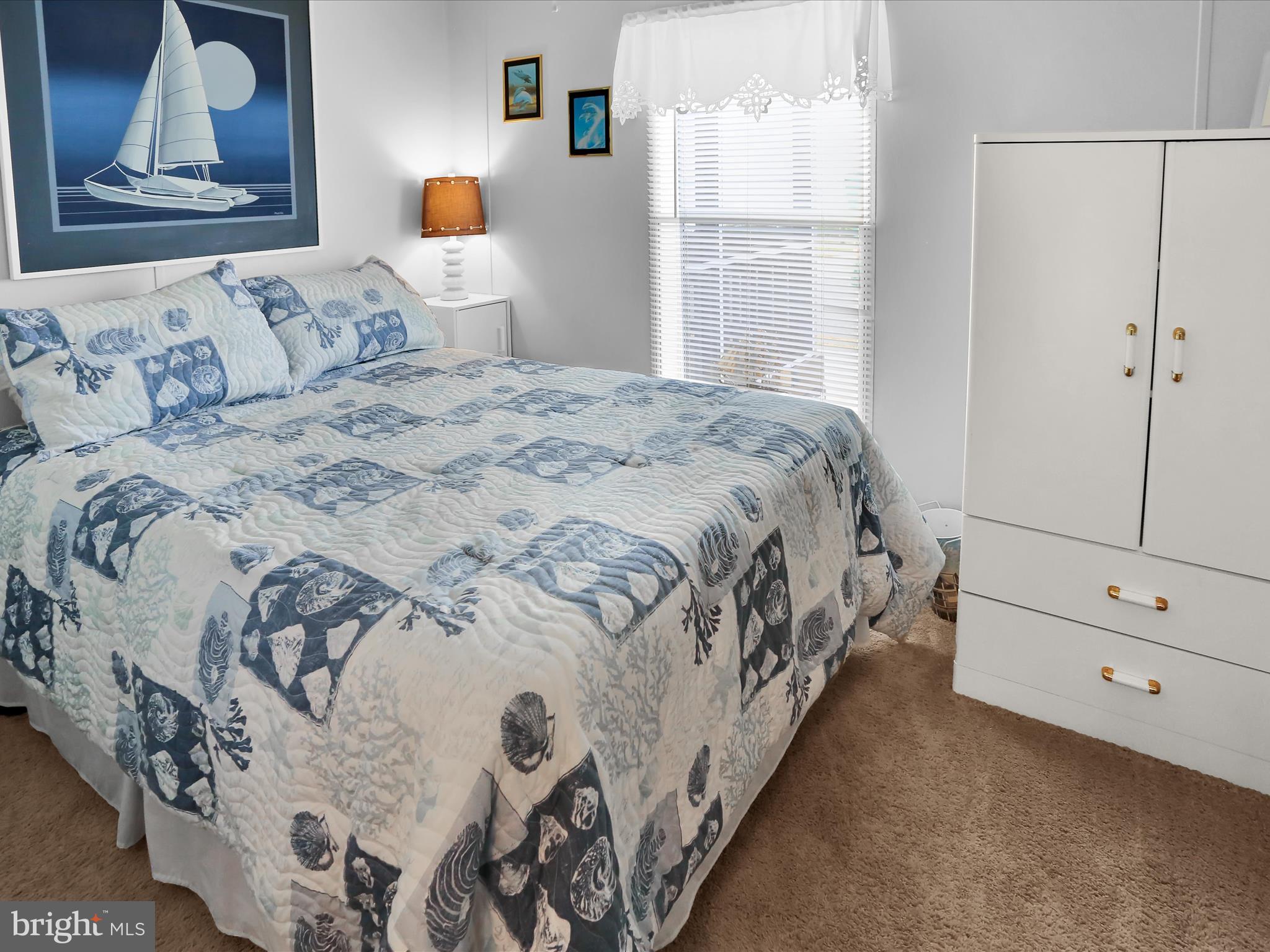 27412 Grove Circle Road Millsboro, DE 19966 - Photo 25 of 43 a bedroom with a bed and window