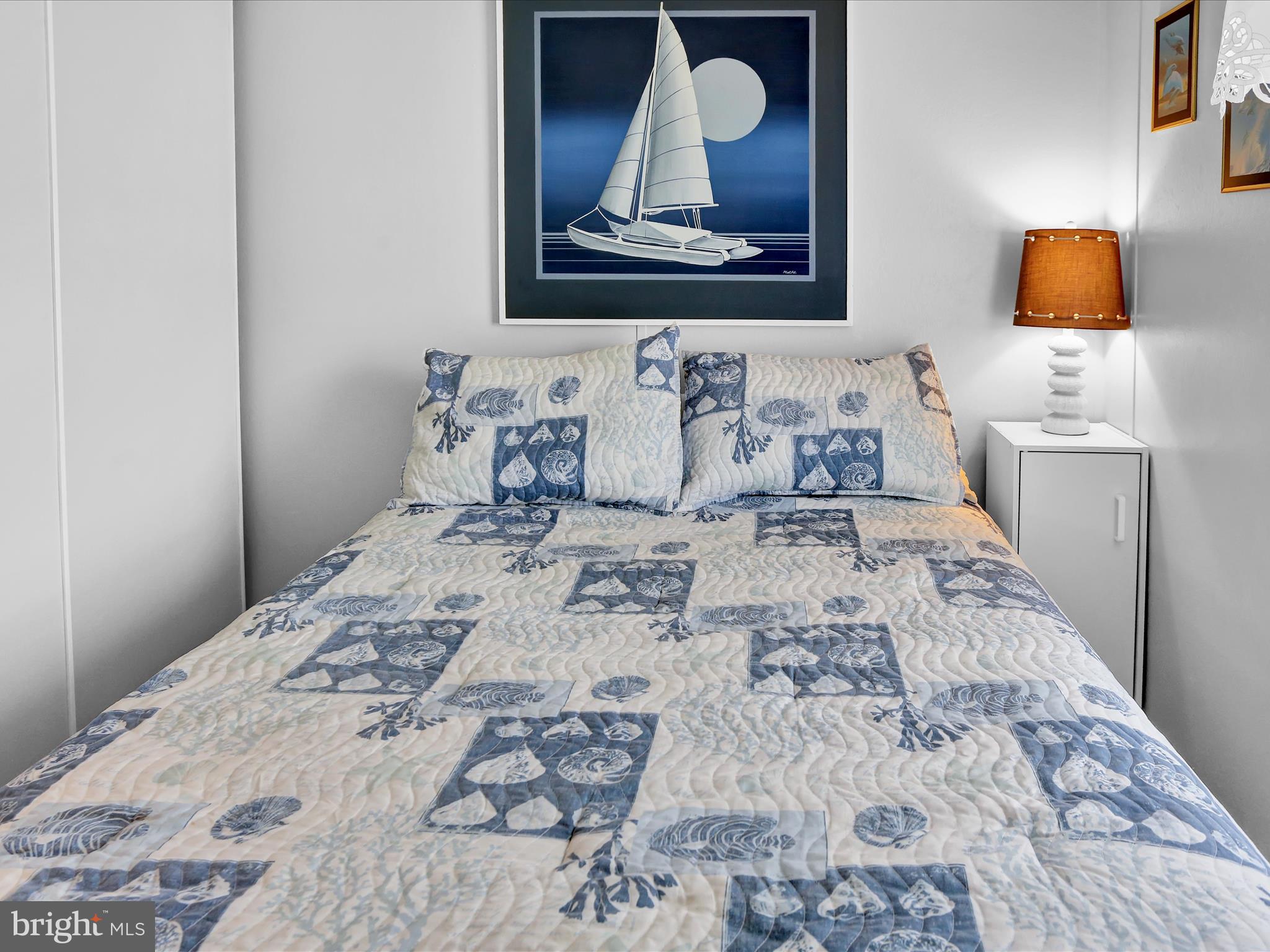 27412 Grove Circle Road Millsboro, DE 19966 - Photo 26 of 43 a bedroom with a bed and a flat screen tv