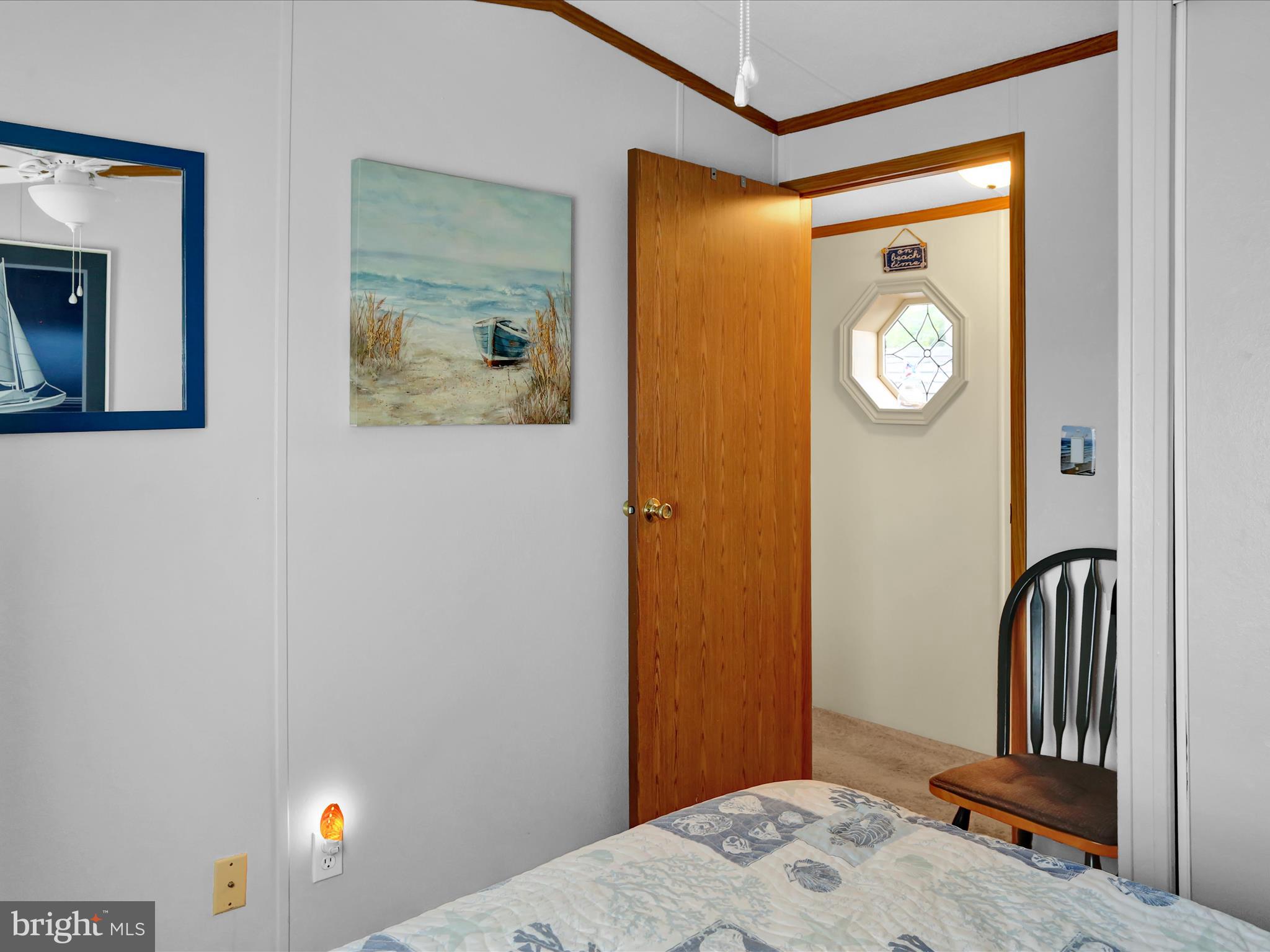 27412 Grove Circle Road Millsboro, DE 19966 - Photo 27 of 43 a bedroom with a bed and a window