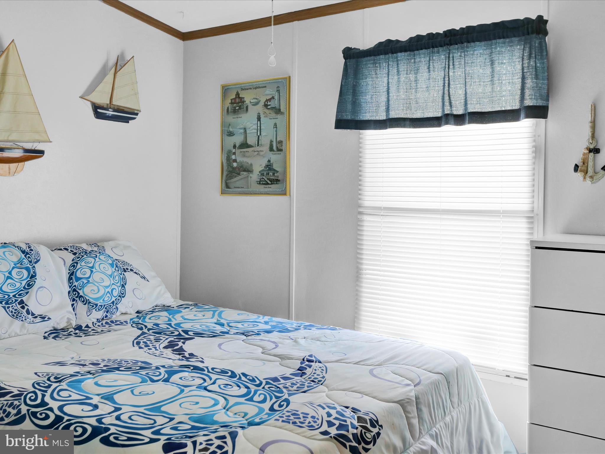 27412 Grove Circle Road Millsboro, DE 19966 - Photo 28 of 43 a bedroom with a bed and a window