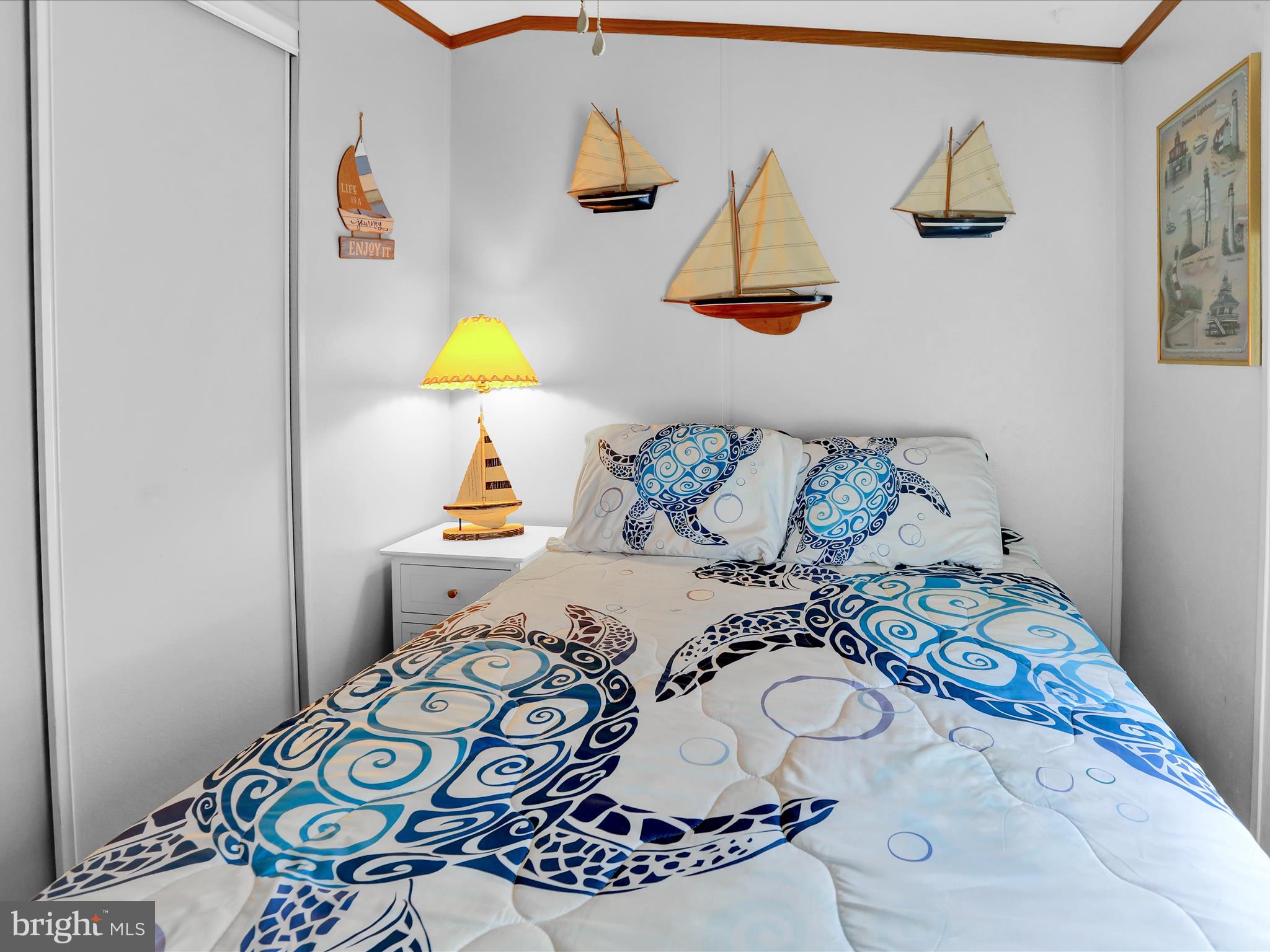 27412 Grove Circle Road Millsboro, DE 19966 - Photo 29 of 43 a bedroom with a bed and a wooden floor