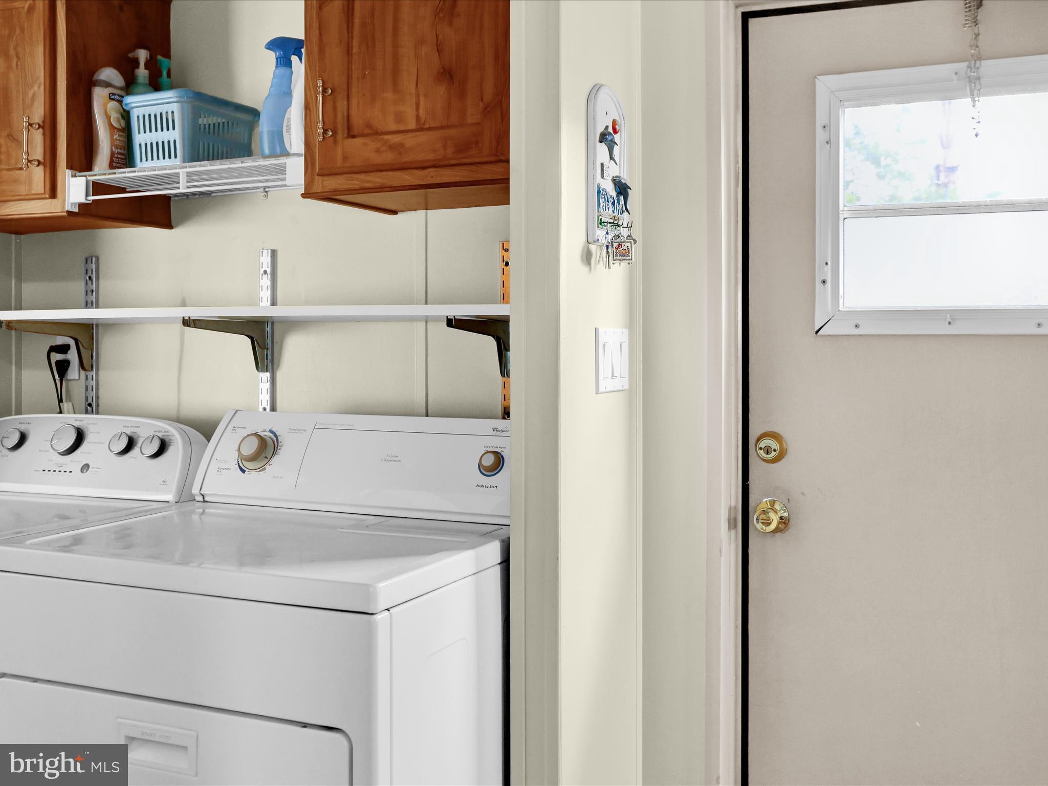 27412 Grove Circle Road Millsboro, DE 19966 - Photo 30 of 43 a close view of a utility room with dryer and washer