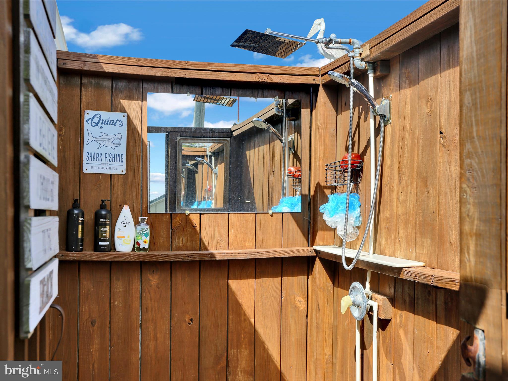 27412 Grove Circle Road Millsboro, DE 19966 - Photo 32 of 43 a view of walk in closet with clothes and shoes