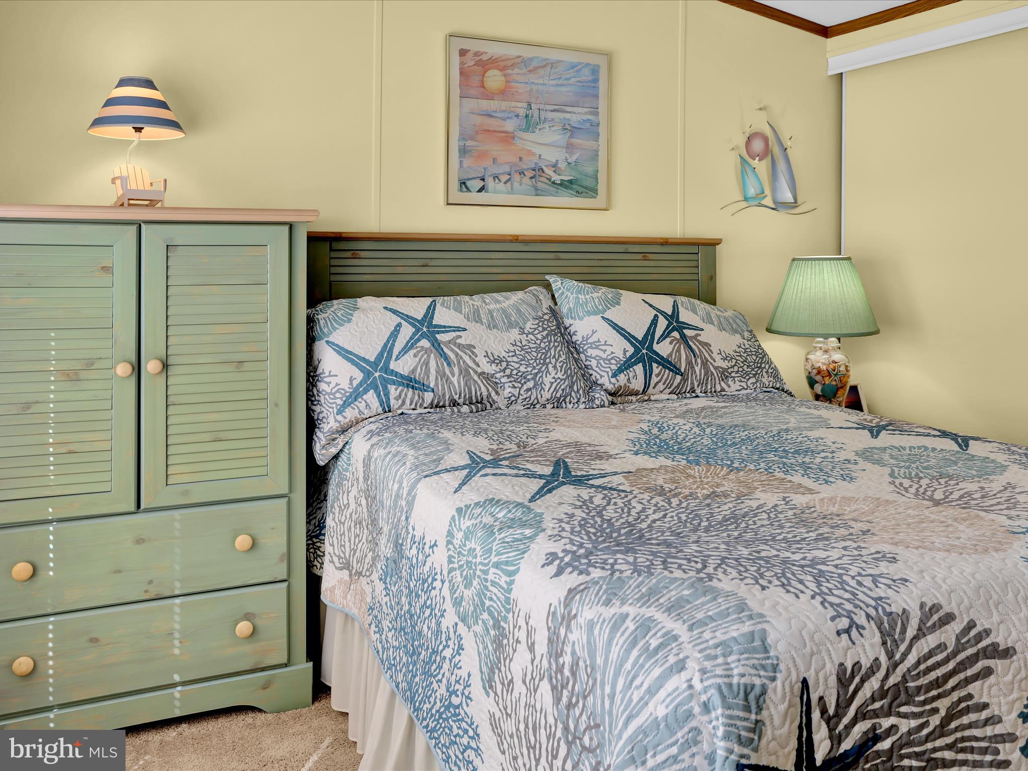 27412 Grove Circle Road Millsboro, DE 19966 - Photo 39 of 43 a bedroom with a bed and a lamp