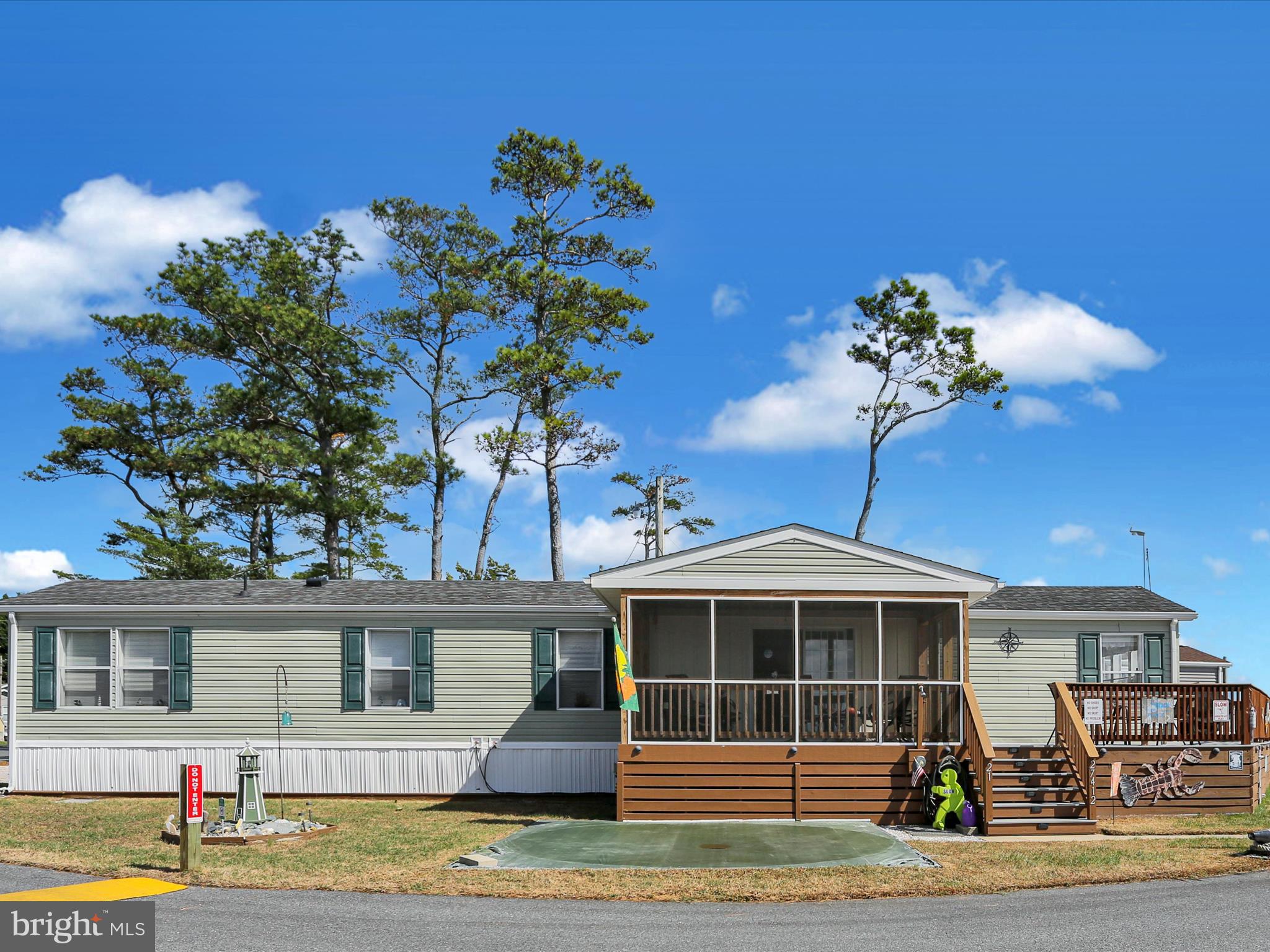 27412 Grove Circle Road Millsboro, DE 19966 - Photo 4 of 43 a front view of a house with a porch