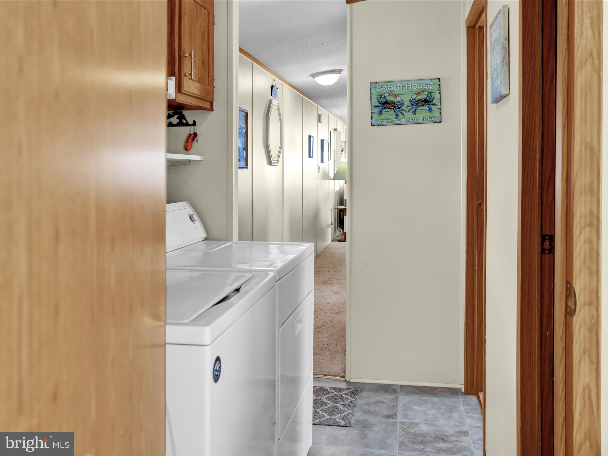27412 Grove Circle Road Millsboro, DE 19966 - Photo 41 of 43 a bathroom with a sink and mirror