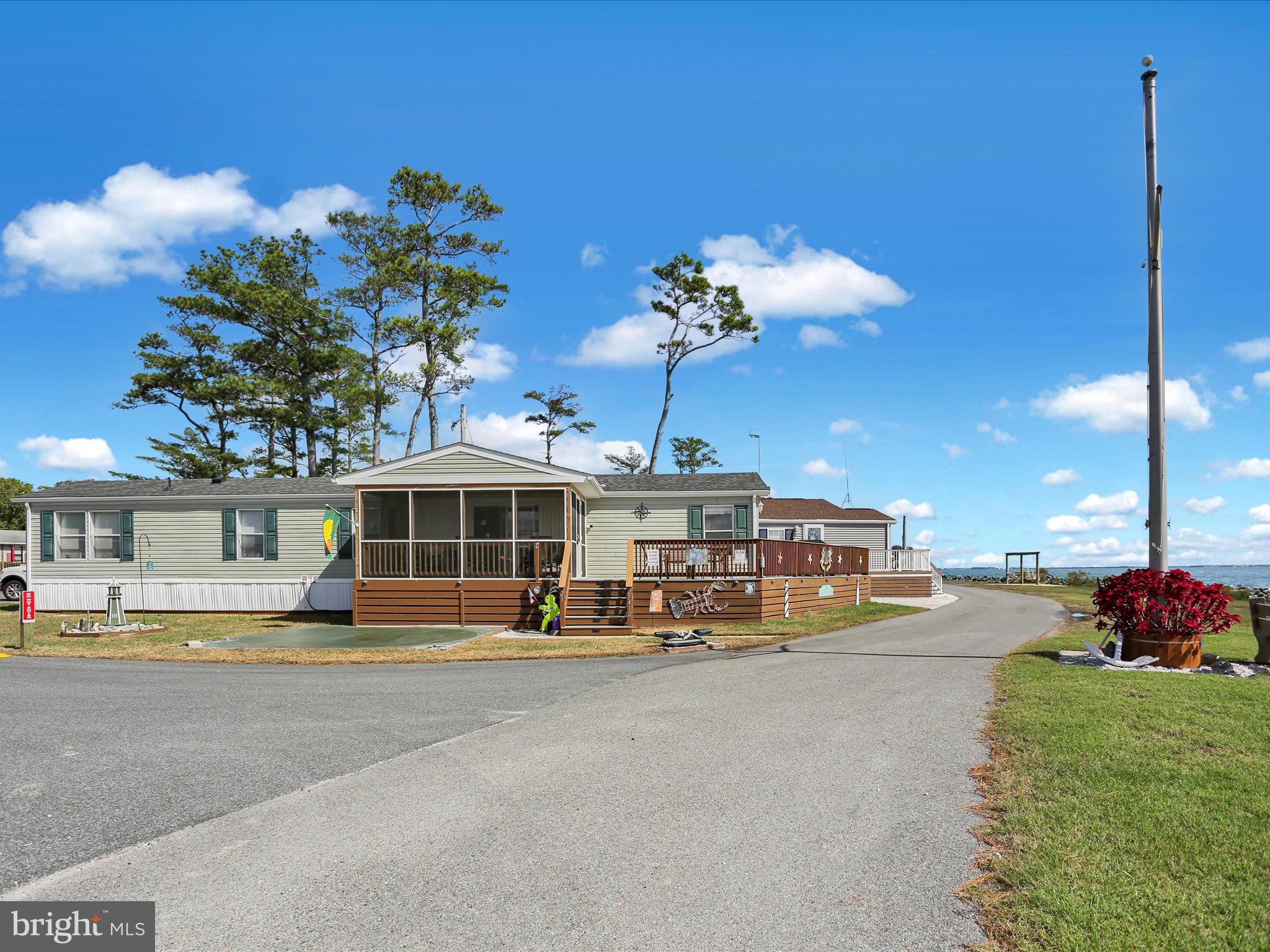 27412 Grove Circle Road Millsboro, DE 19966 - Photo 5 of 43 a view of a house with a swimming pool