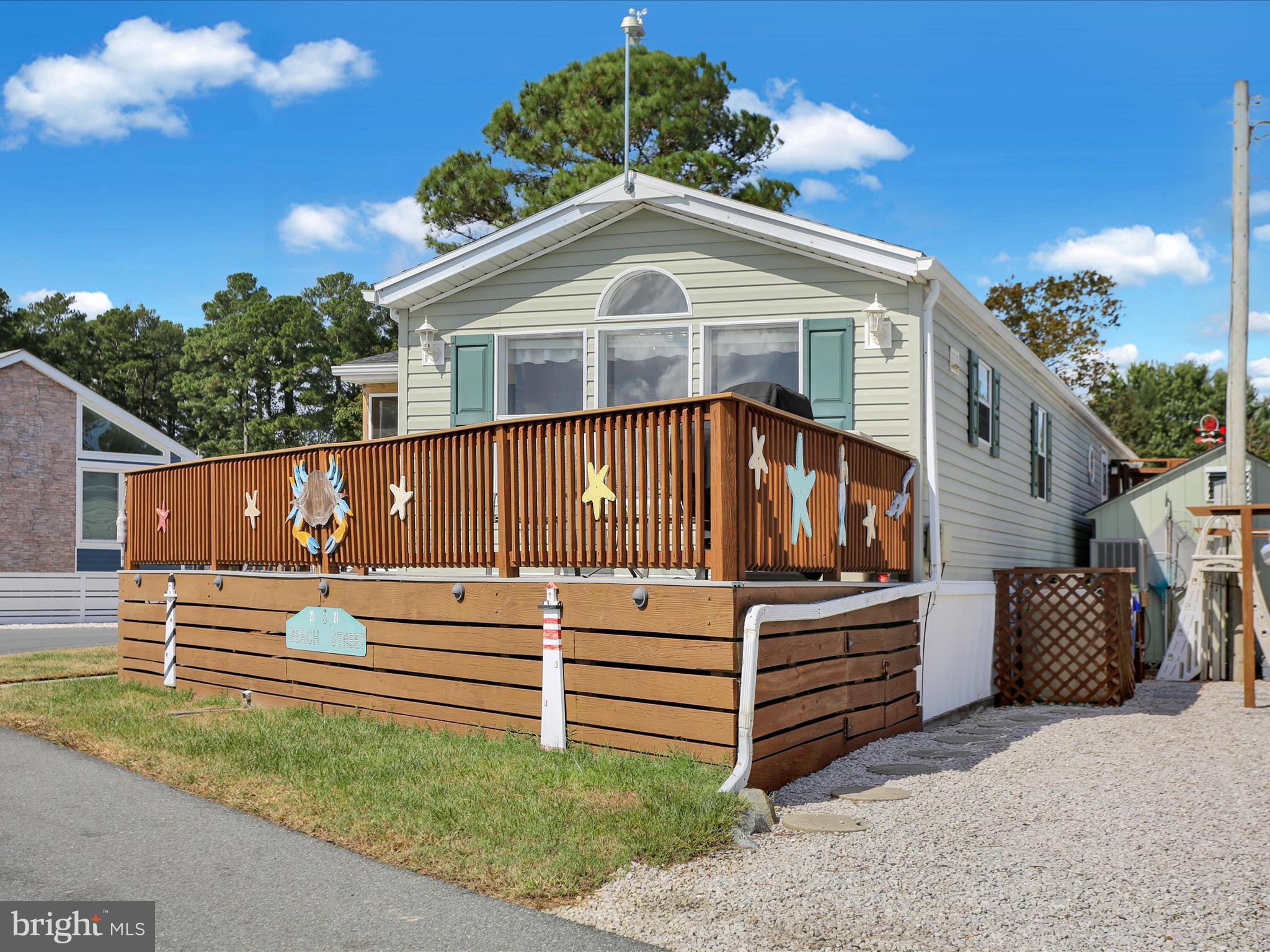 27412 Grove Circle Road Millsboro, DE 19966 - Photo 6 of 43 a front view of a house with a yard