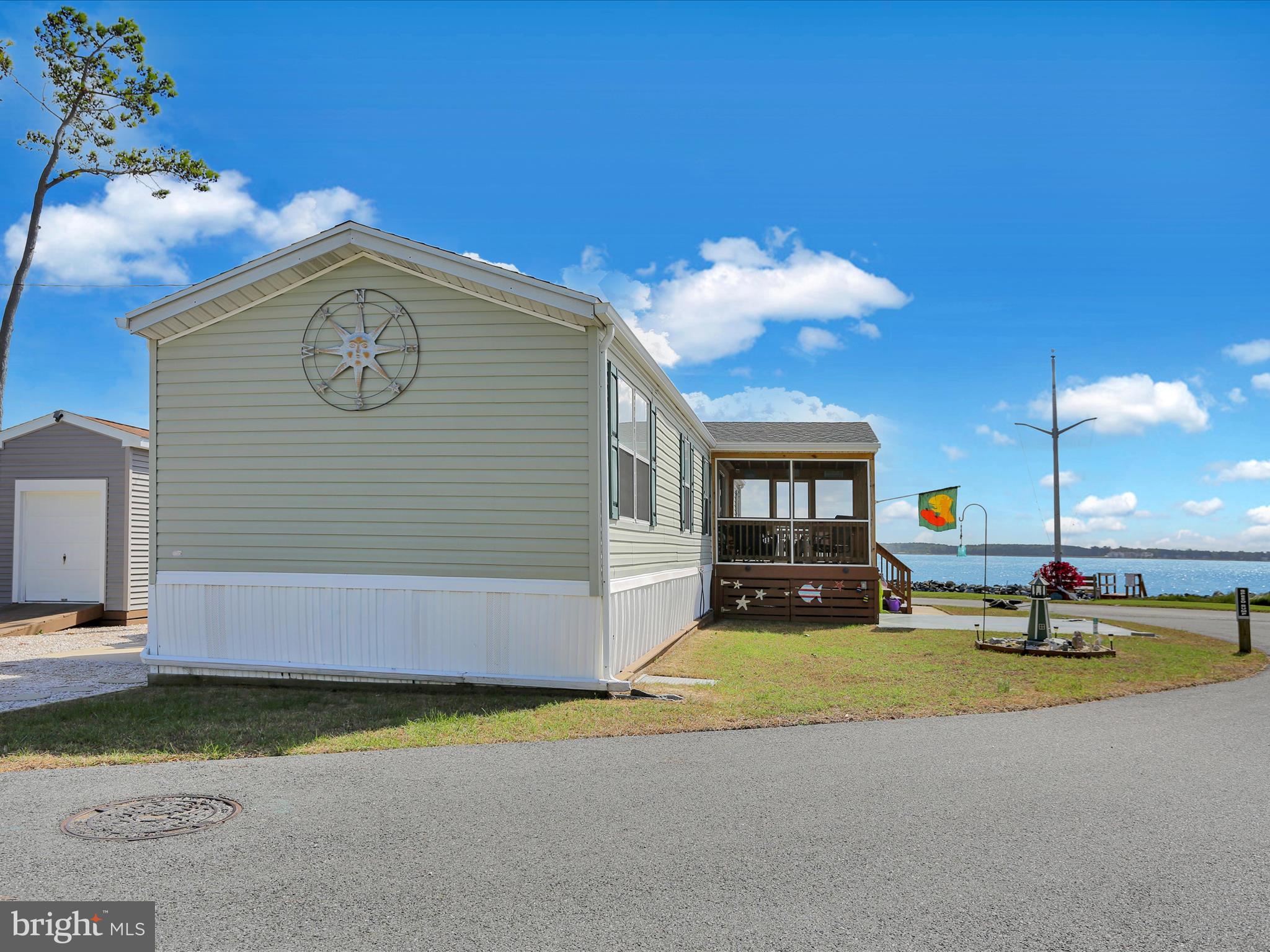 27412 Grove Circle Road Millsboro, DE 19966 - Photo 7 of 43 a view of a house with a swimming pool